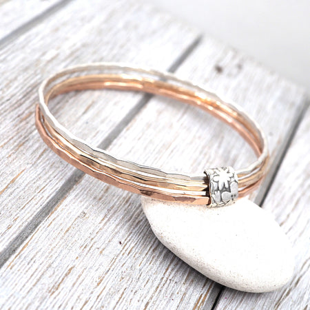 Silver, bronze and copper bangle set