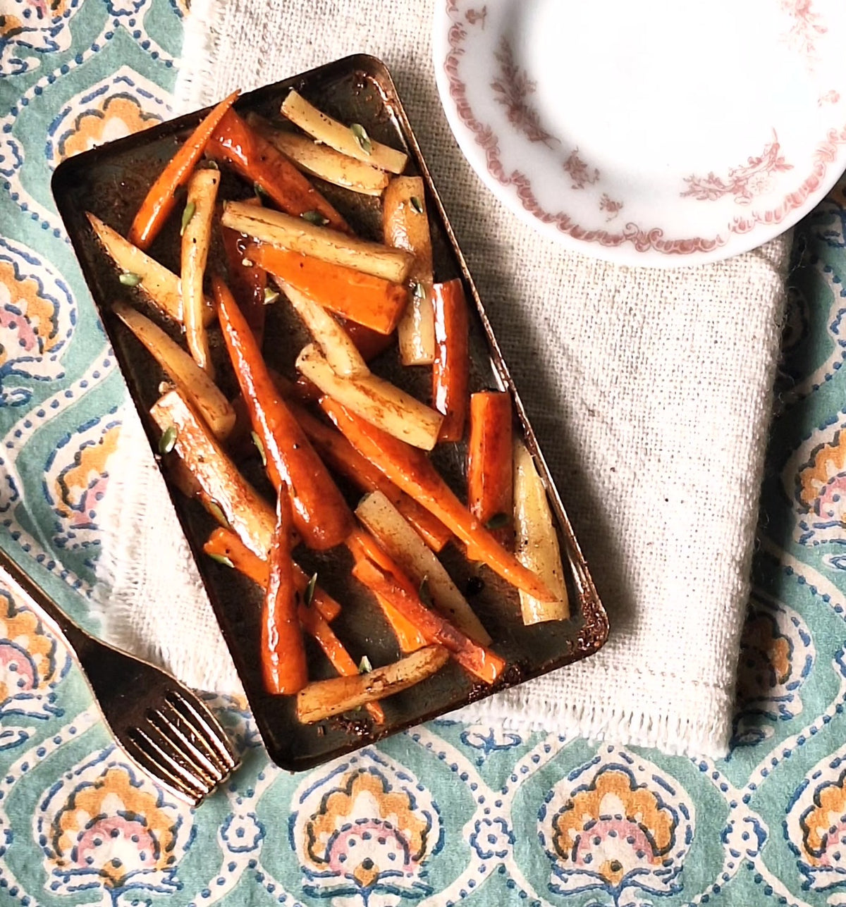 Honey roasted Carrot and Parsnips (with metal serving spoon)