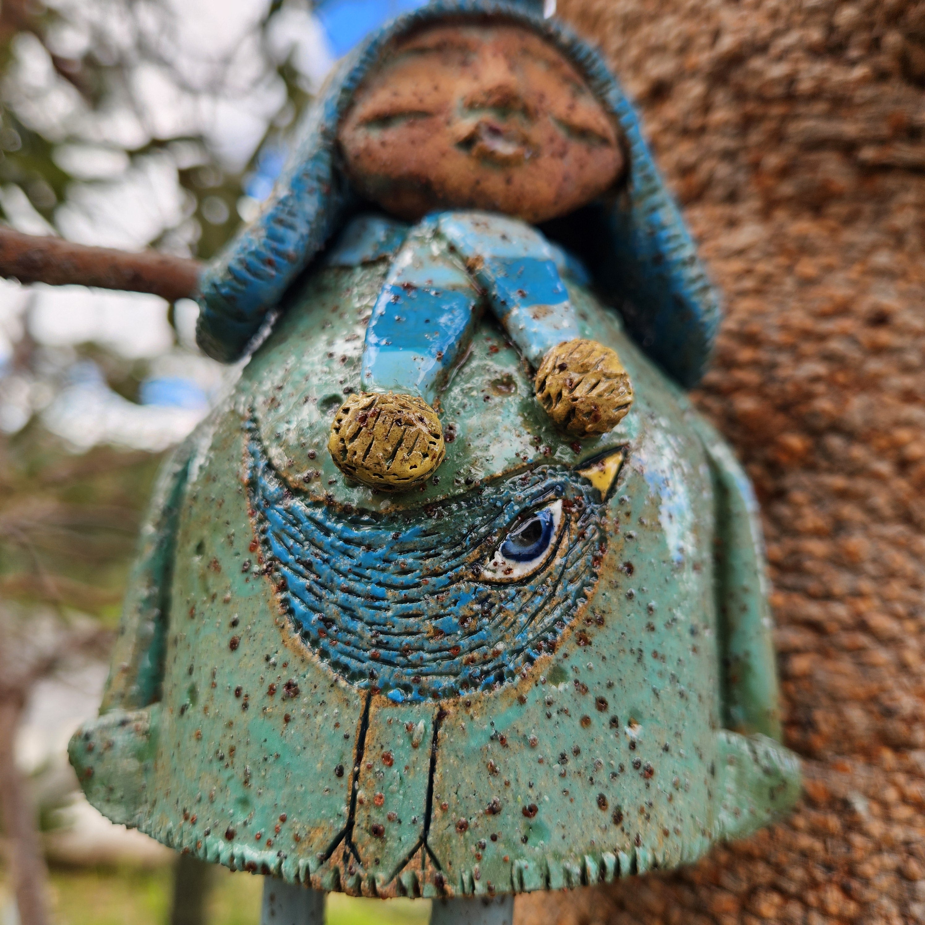 Clay windchime, little girl, bird