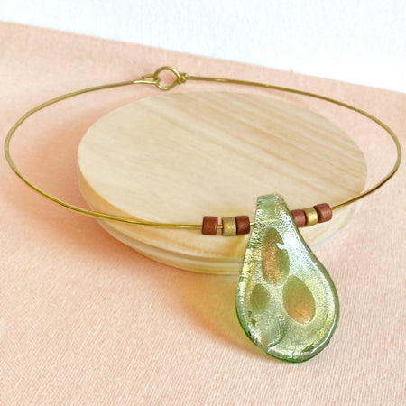 Green glass lampwork pendant on gold brass choker necklace