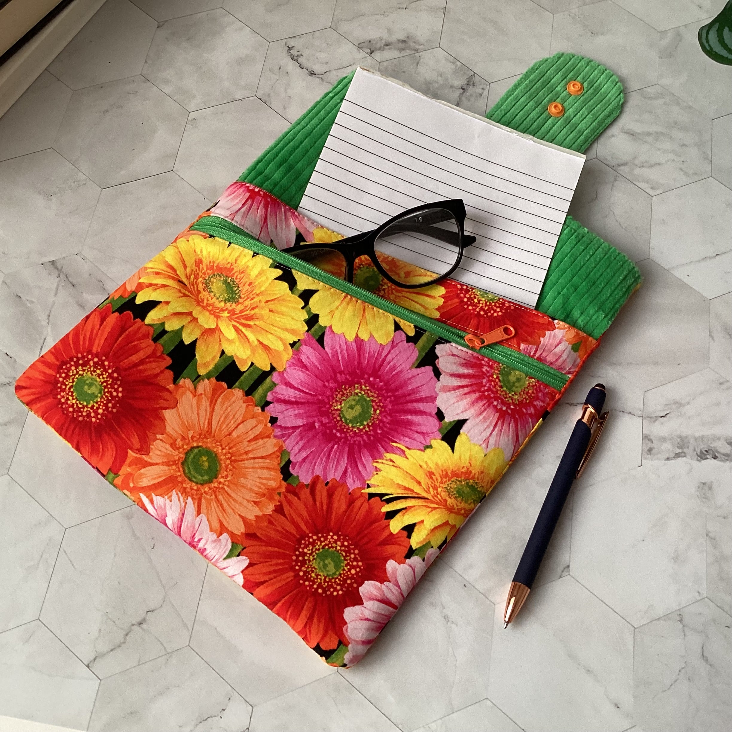 Colourful daisies book sleeve with 2 pockets. iPad, tablet pouch