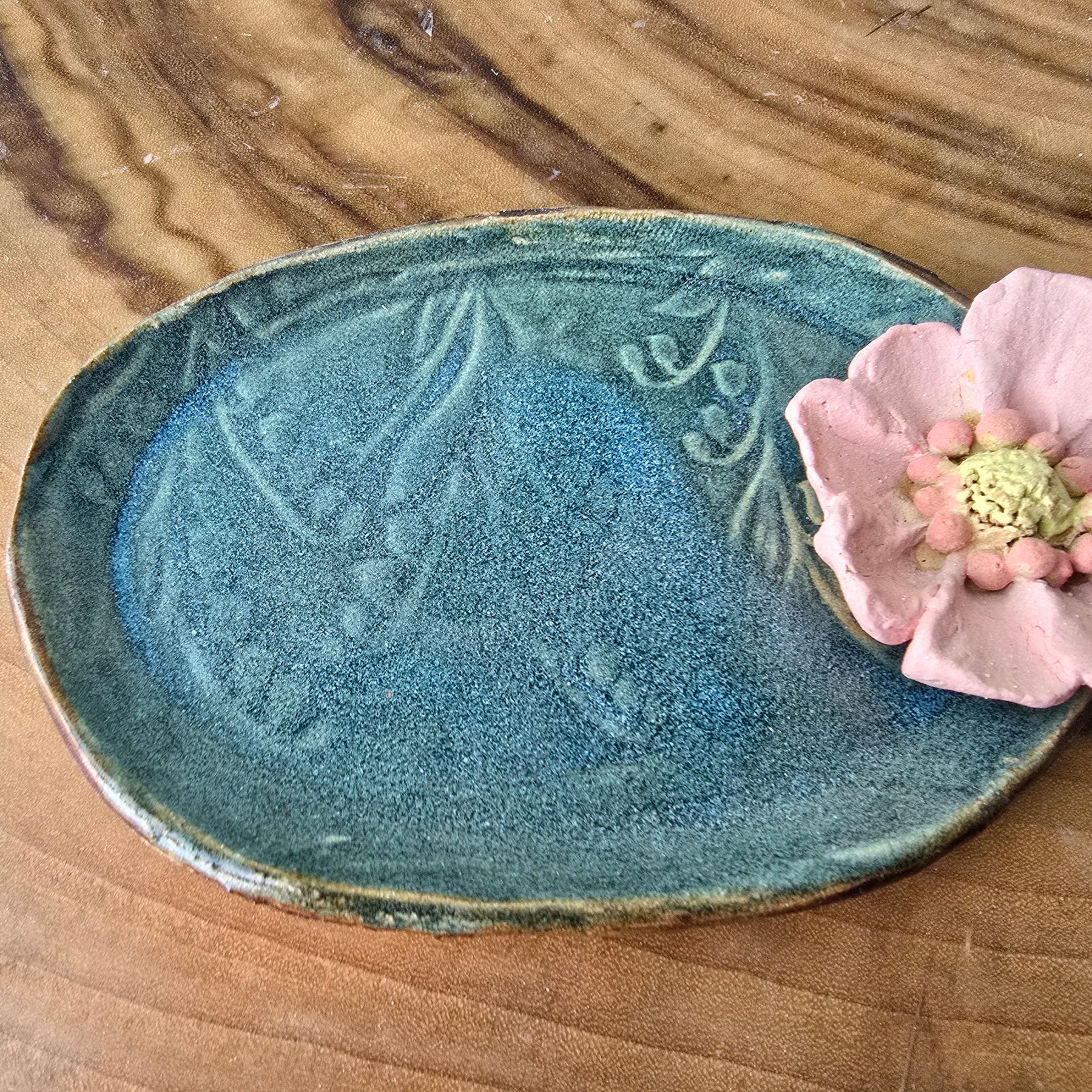 Turquoise floral trinket dish.