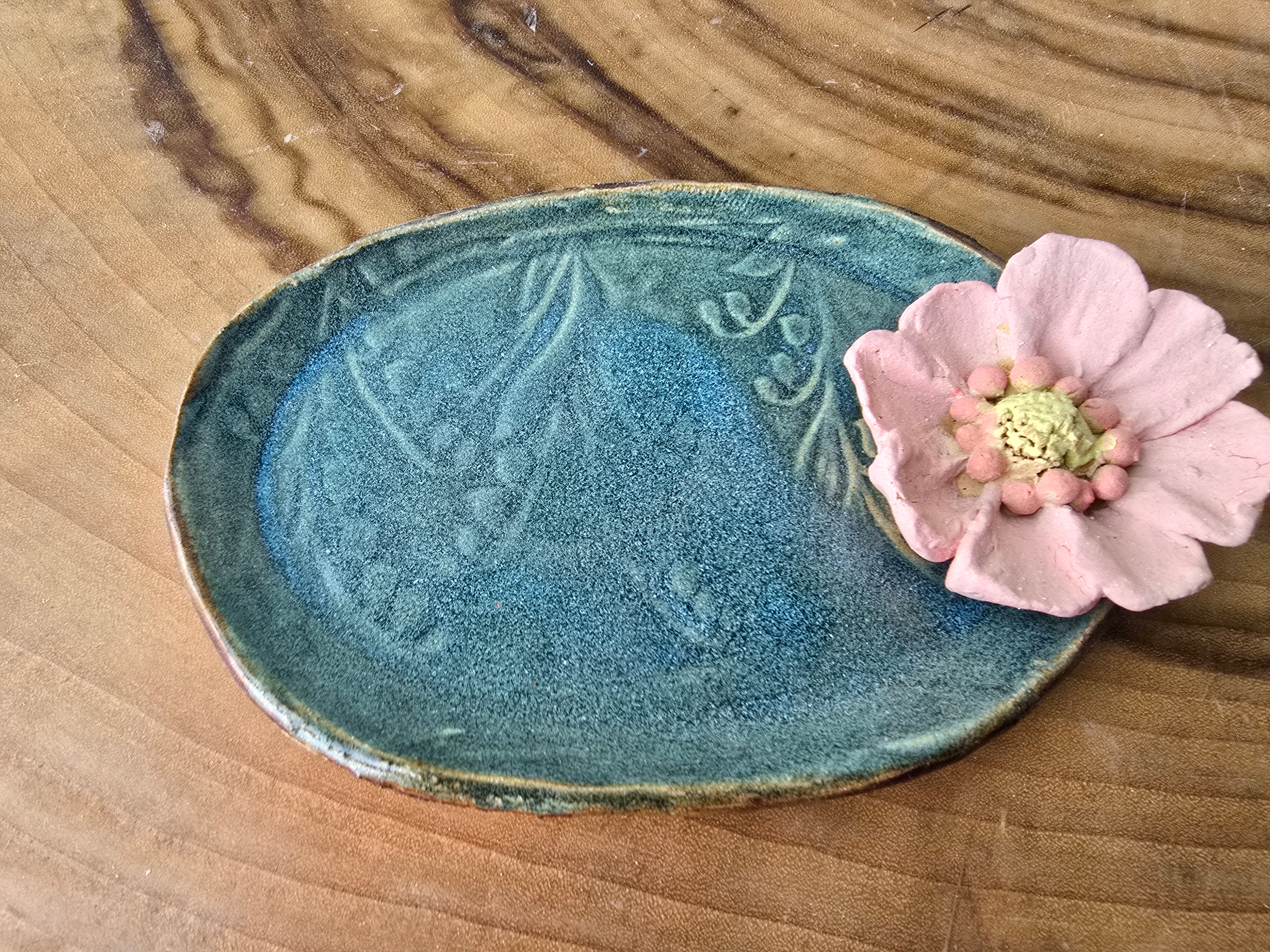 Turquoise floral trinket dish.