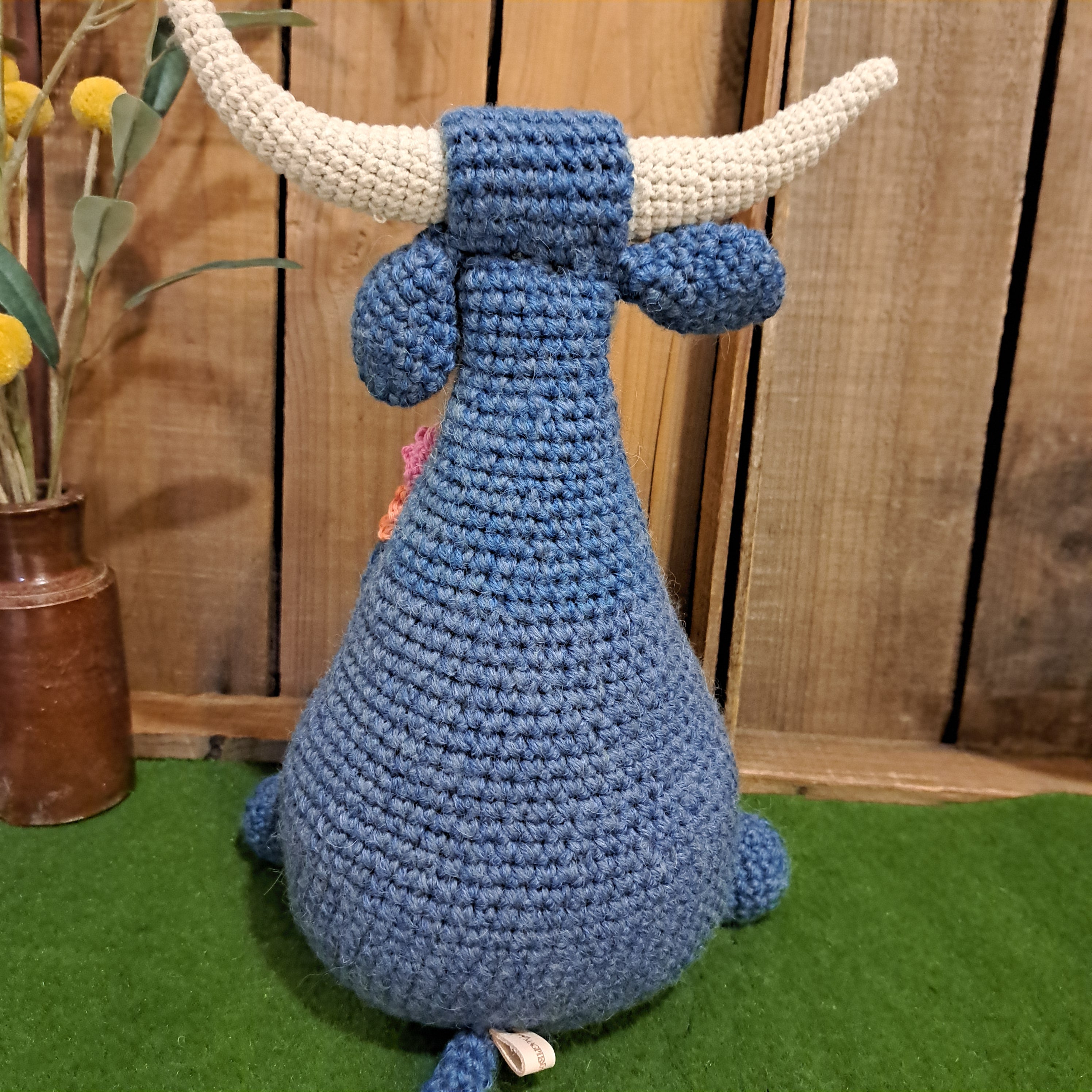 Handmade Highland cow crochet character doorstop in blue