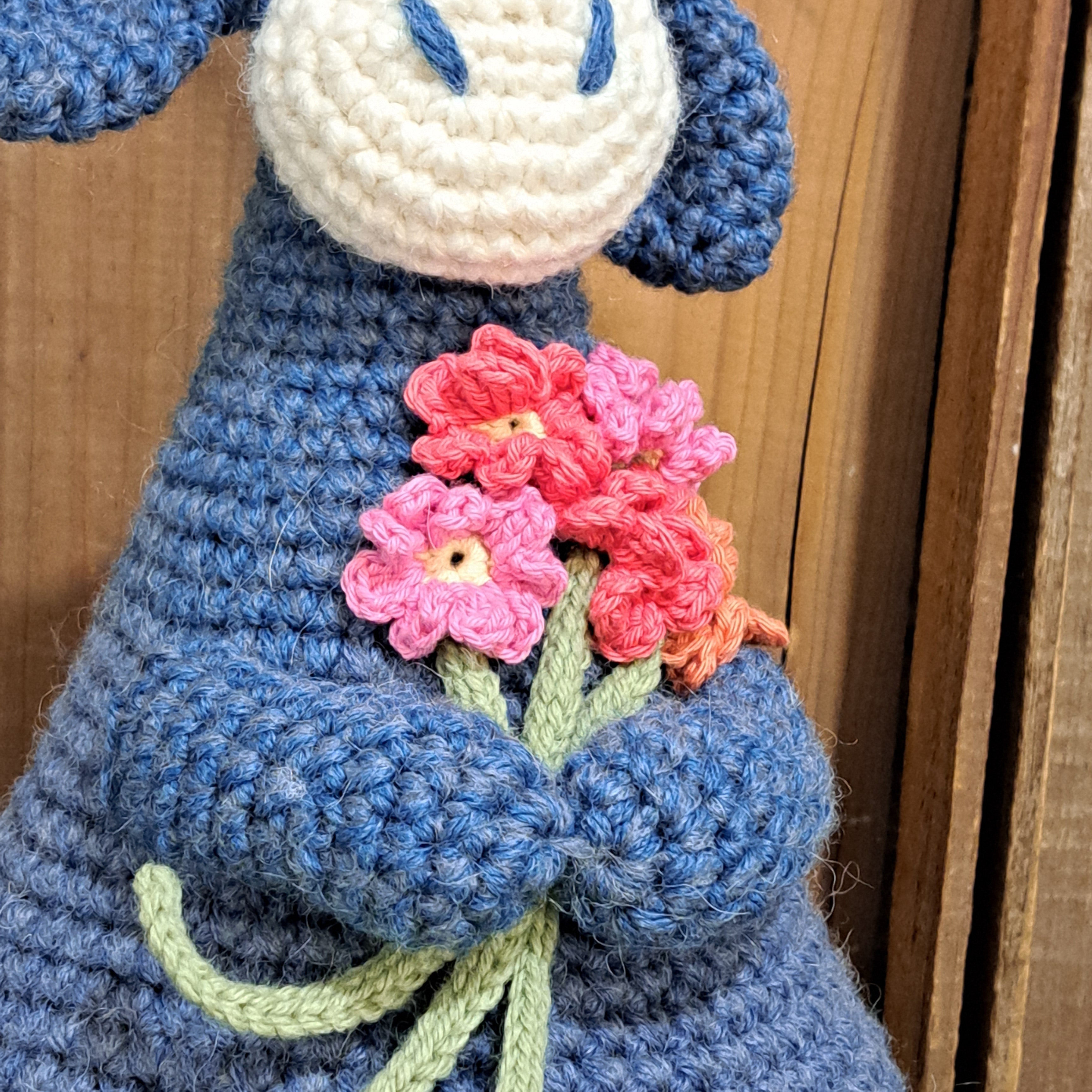 Handmade Highland cow crochet character doorstop in blue