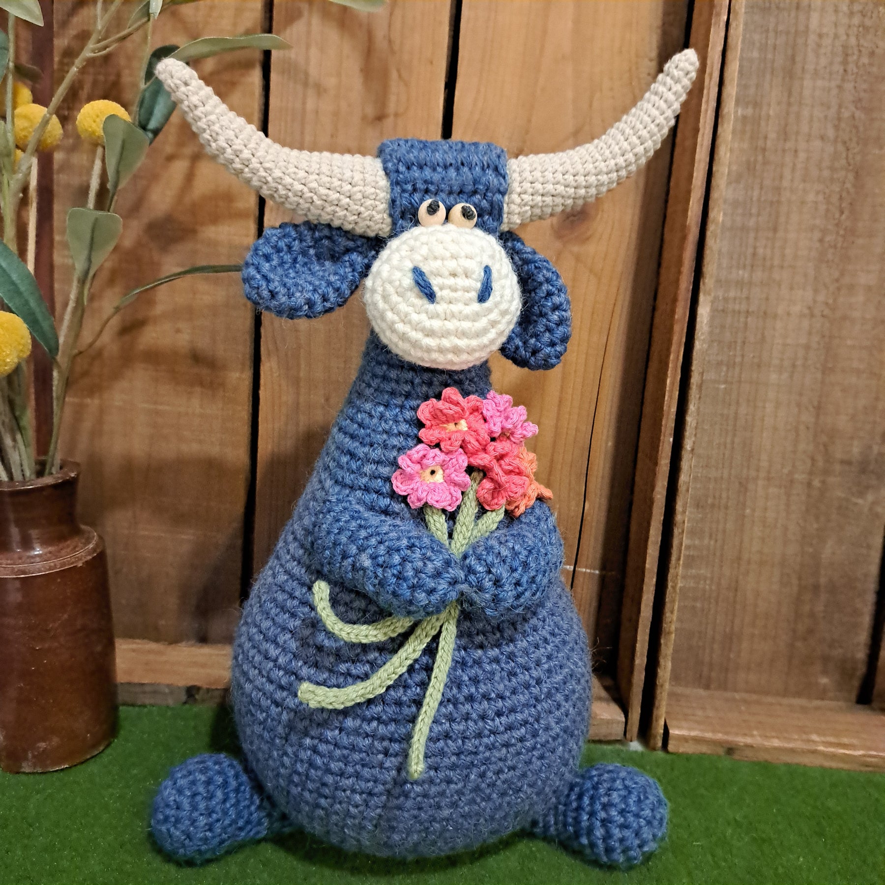 Handmade Highland cow crochet character doorstop in blue