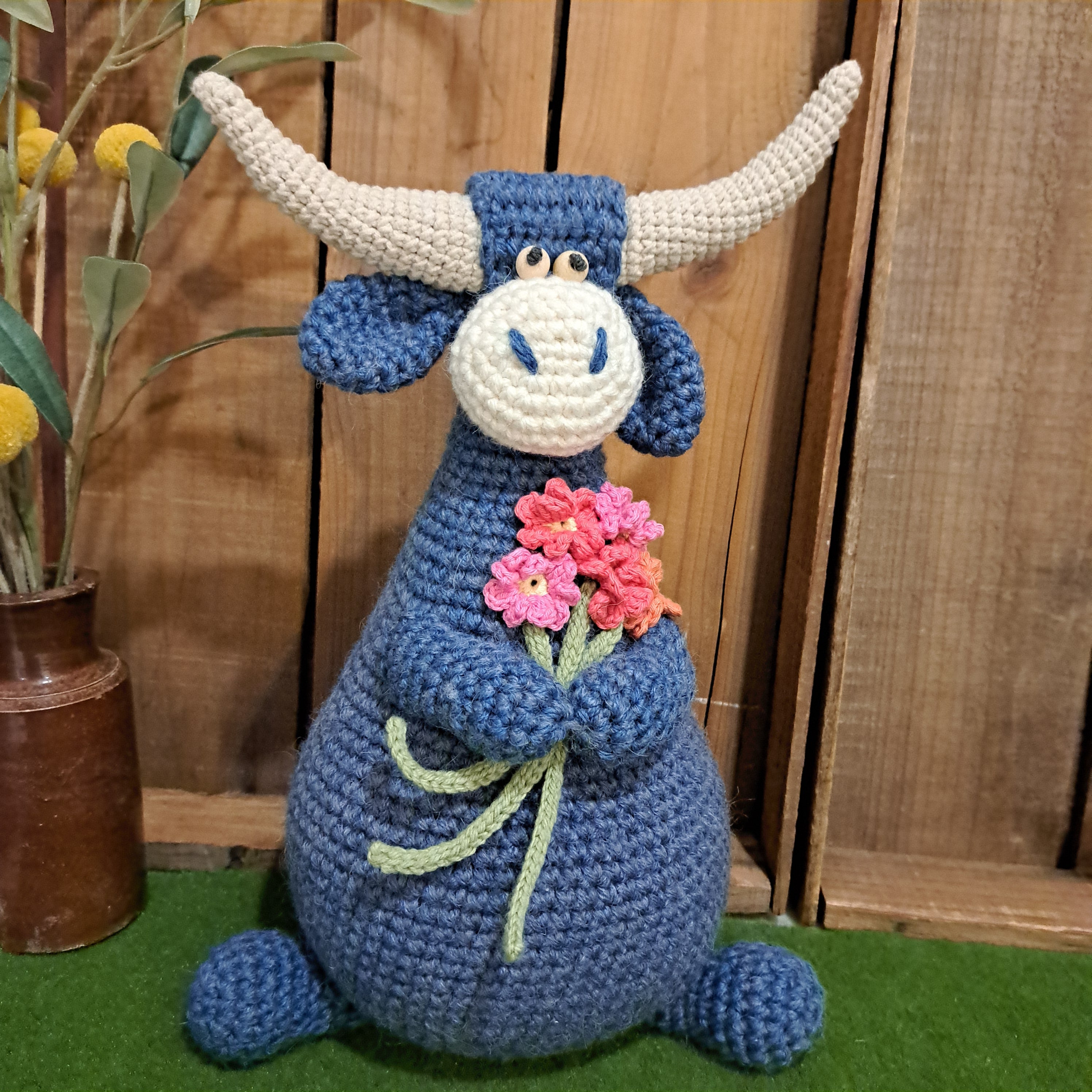 Handmade Highland cow crochet character doorstop in blue