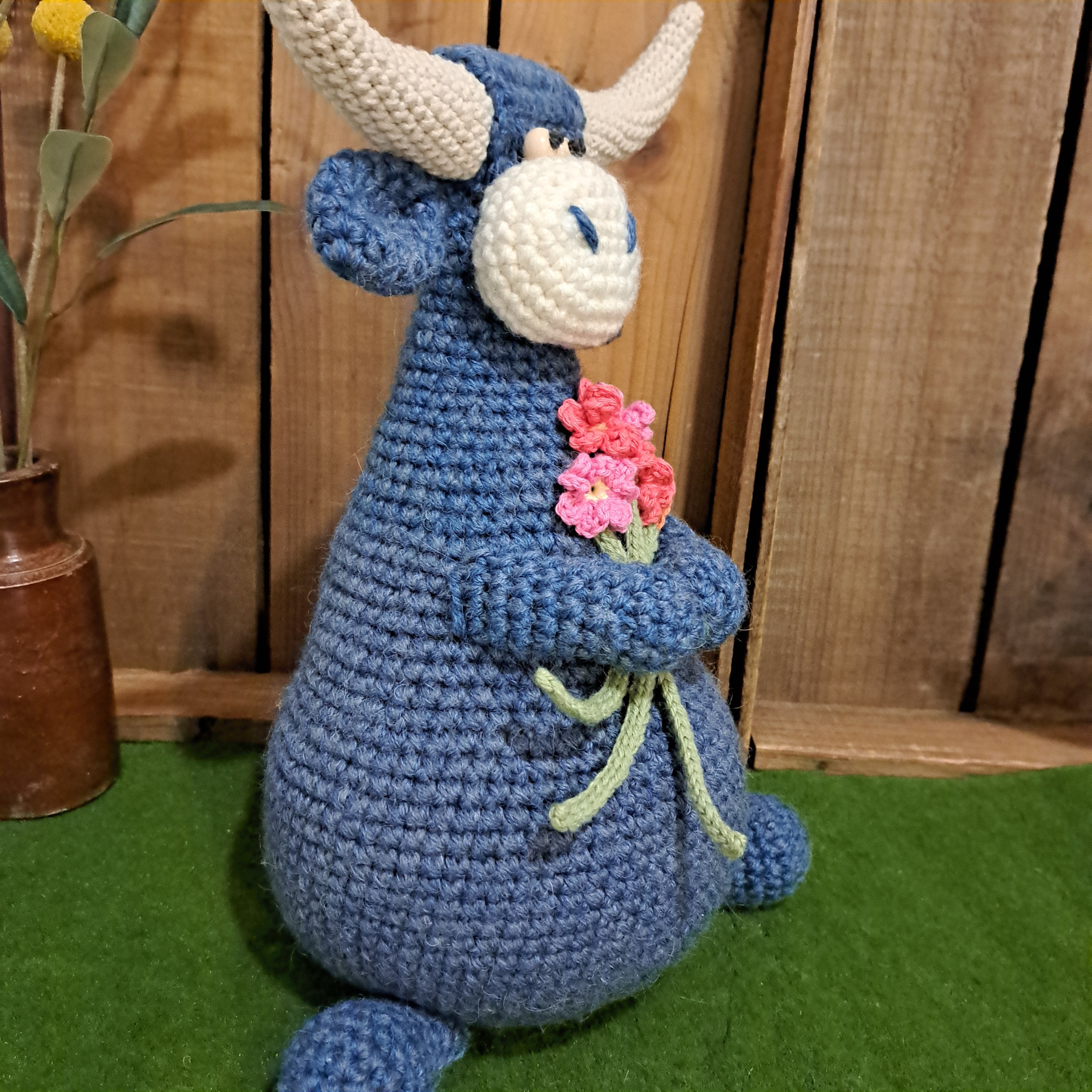 Handmade Highland cow crochet character doorstop in blue