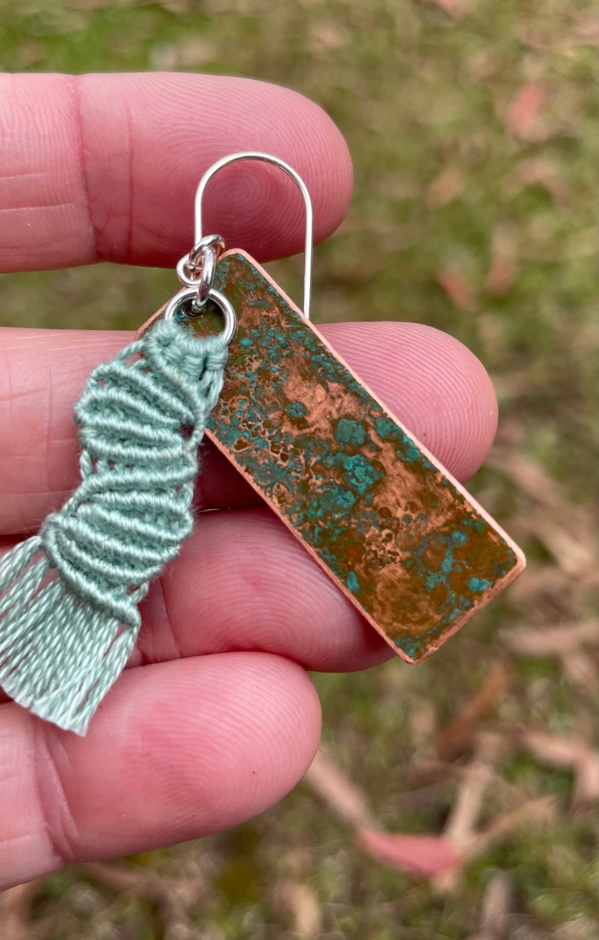 Sage green macrame thread on patinated copper