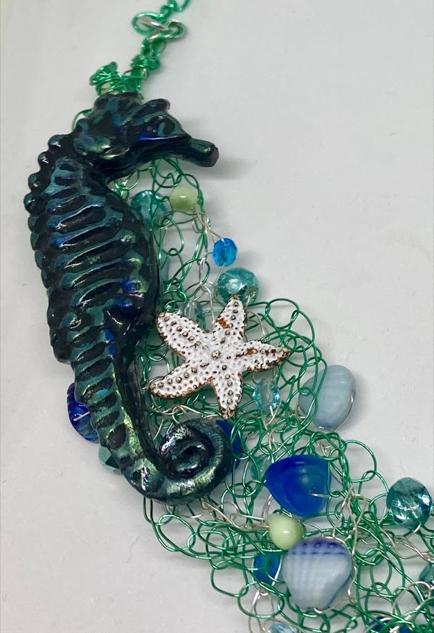 Beaded wire crochet necklace with seahorse focal