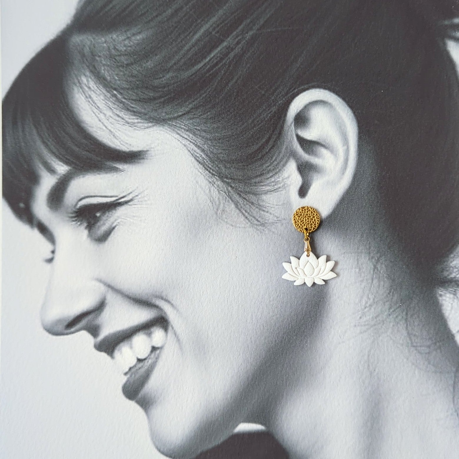 White Earrings With Gold Findings in Different Designs.