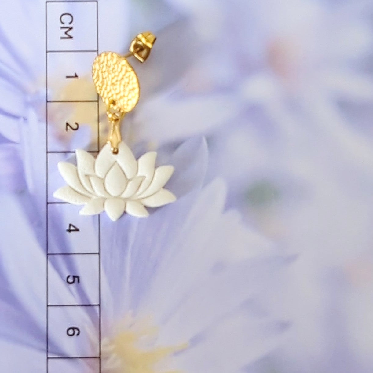 White Earrings With Gold Findings in Different Designs.