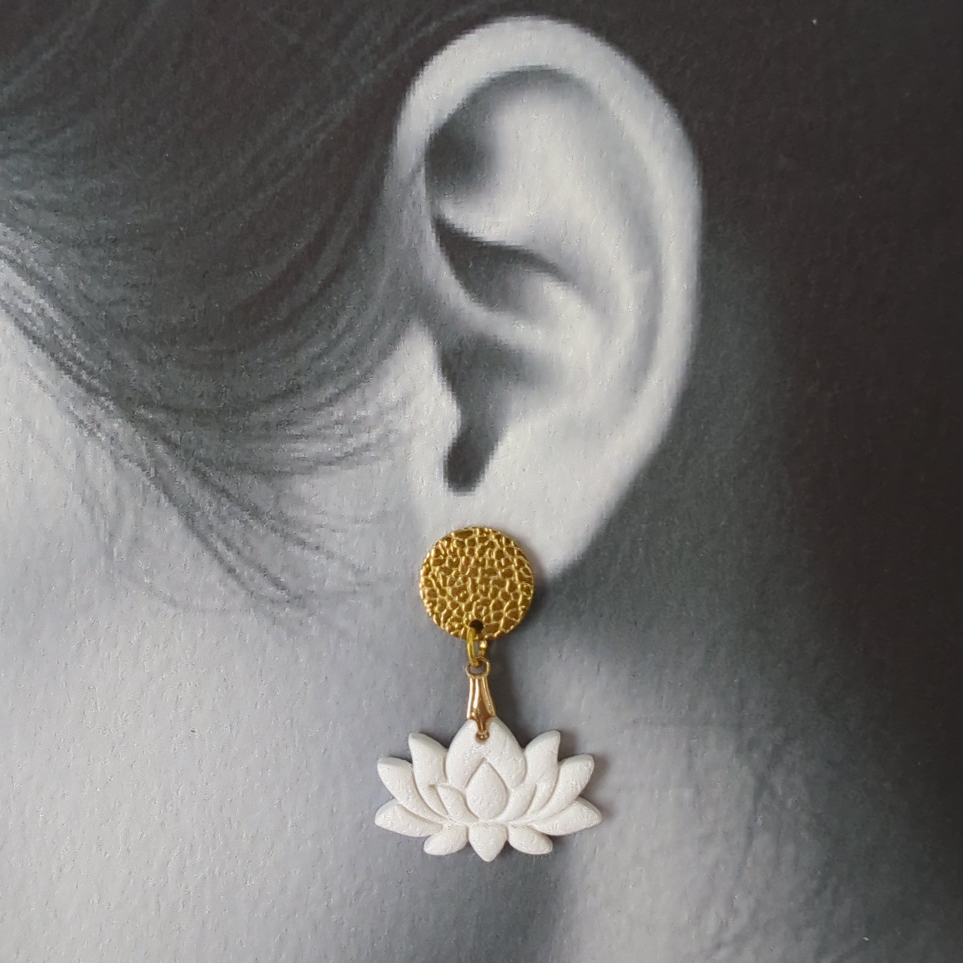 White Earrings With Gold Findings in Different Designs.