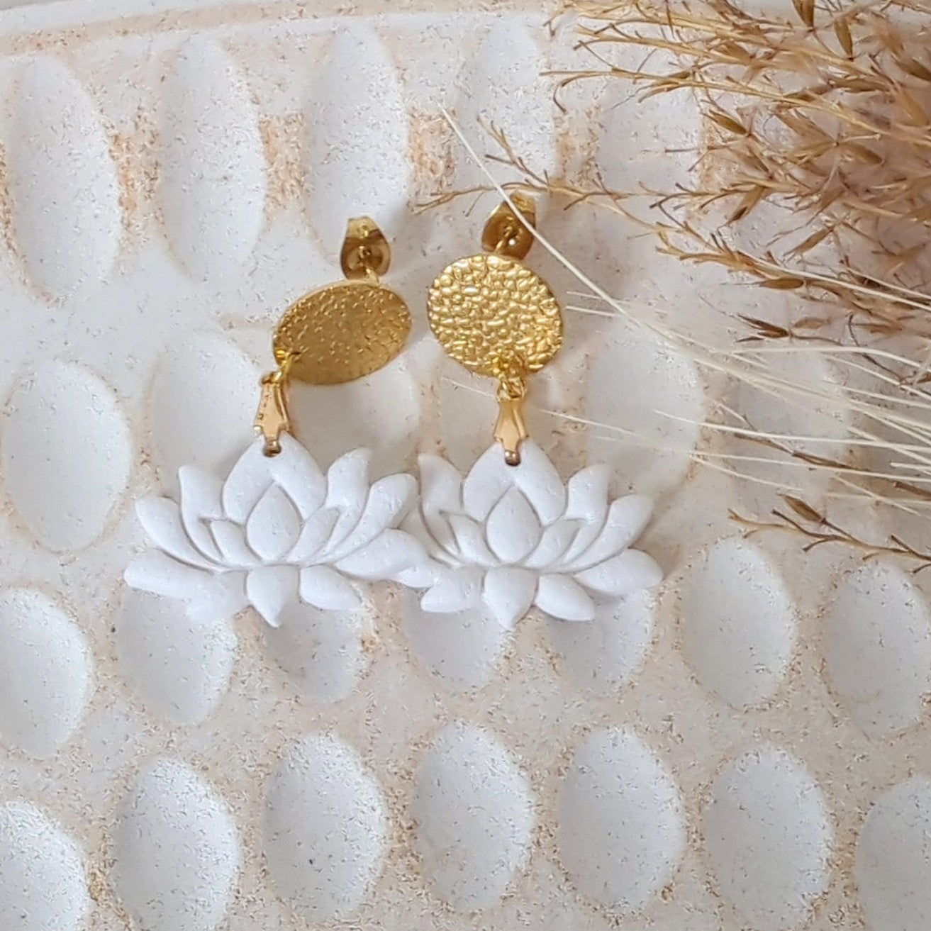 White Earrings With Gold Findings in Different Designs.