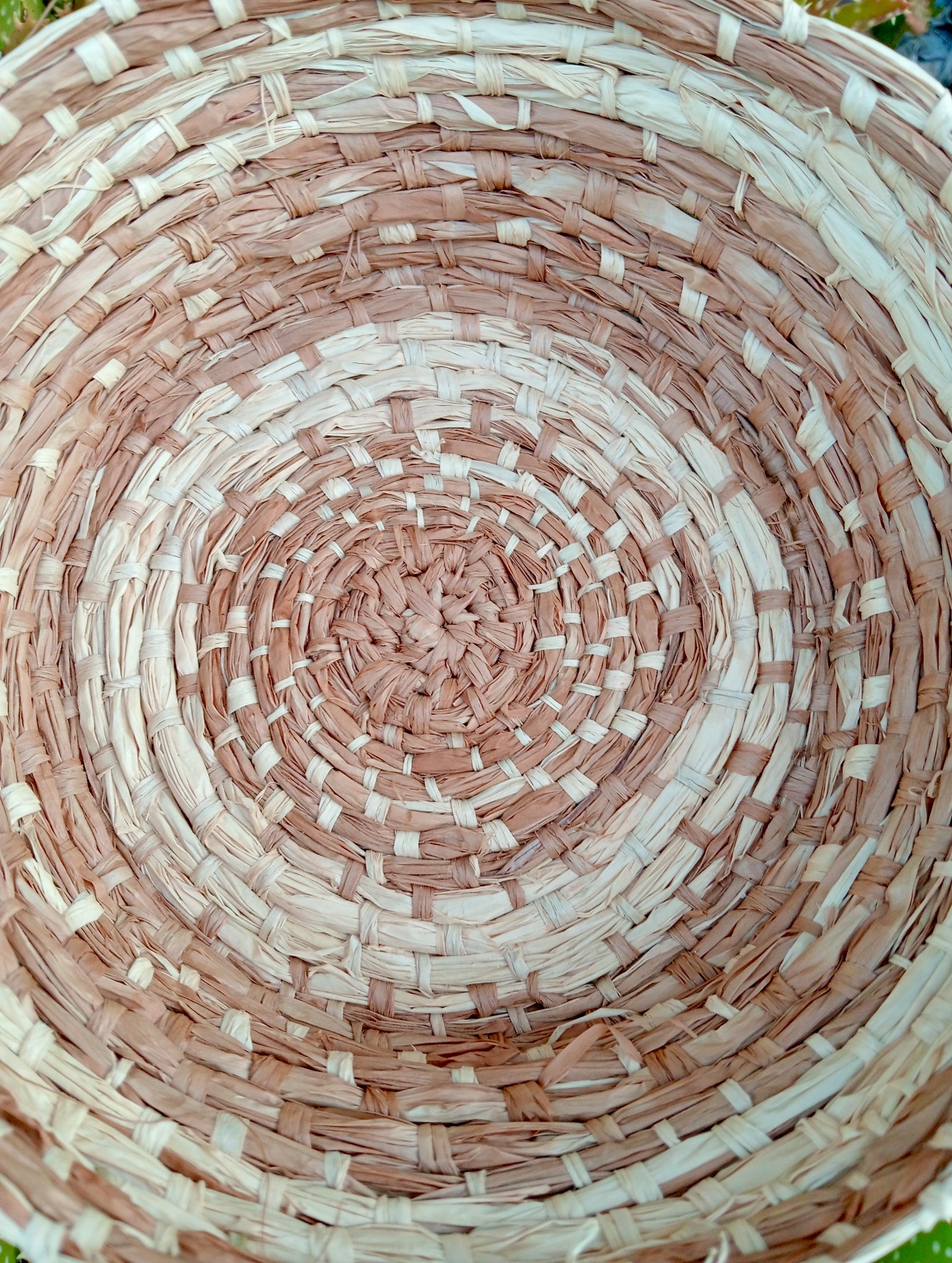 Woven hand dyed raffia basket