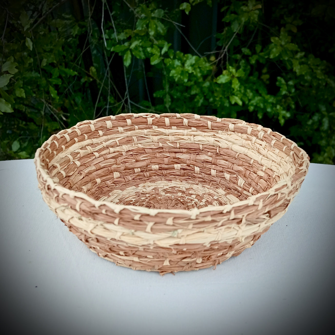 Woven hand dyed raffia basket