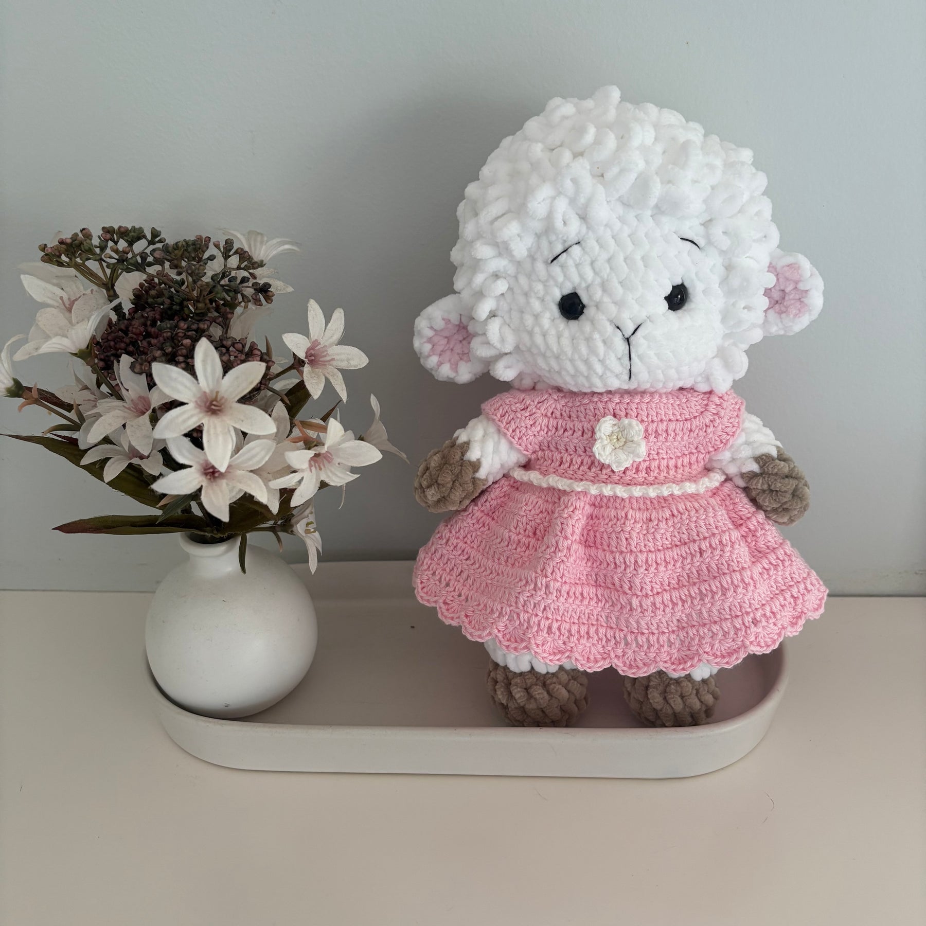 Crochet lamb in a pink dress