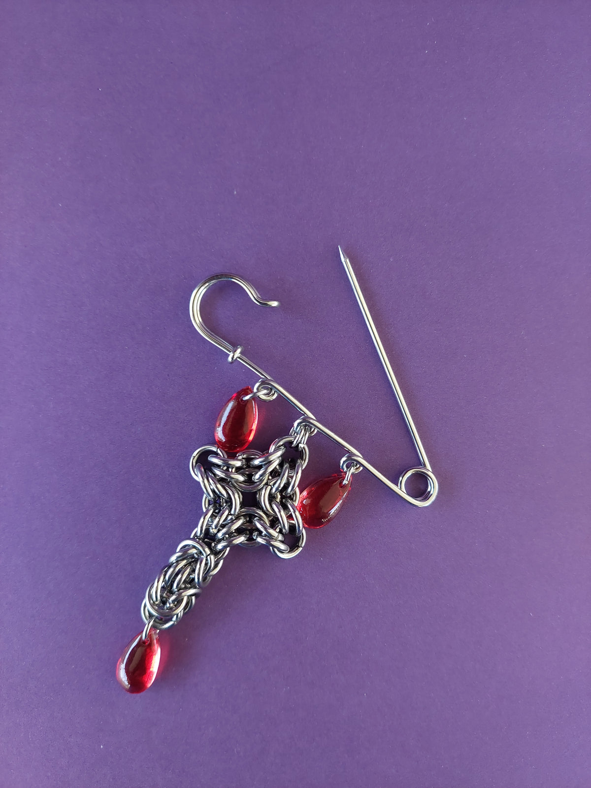 Bleeding cross brooch