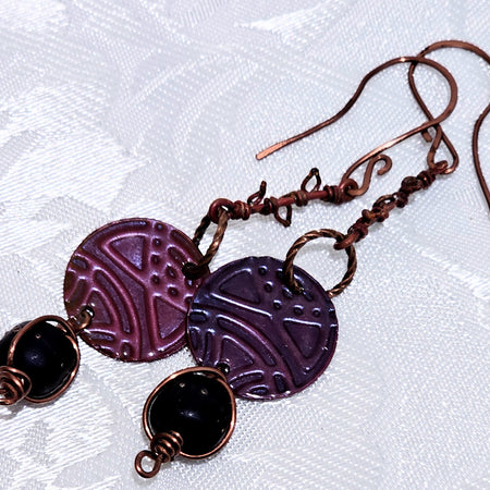 Suspended Pressed Metal Discs with Barbed Wirework Link and Black Matt Lampwork bead