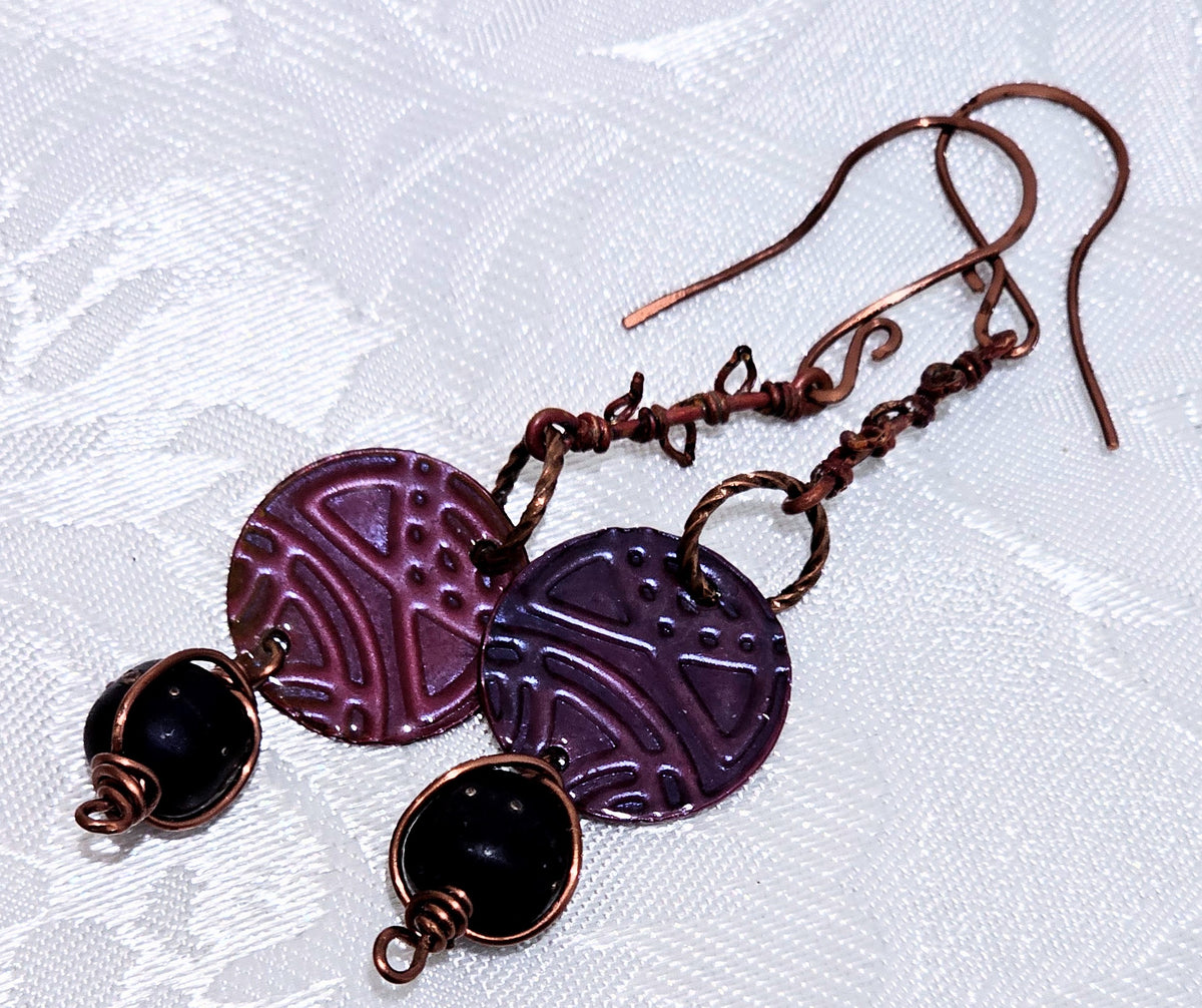 Suspended Pressed Metal Discs with Barbed Wirework Link and Black Matt Lampwork bead