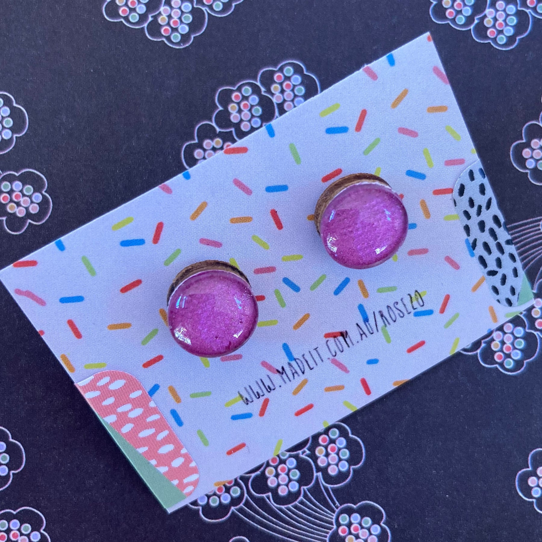 Magenta glass domed studs