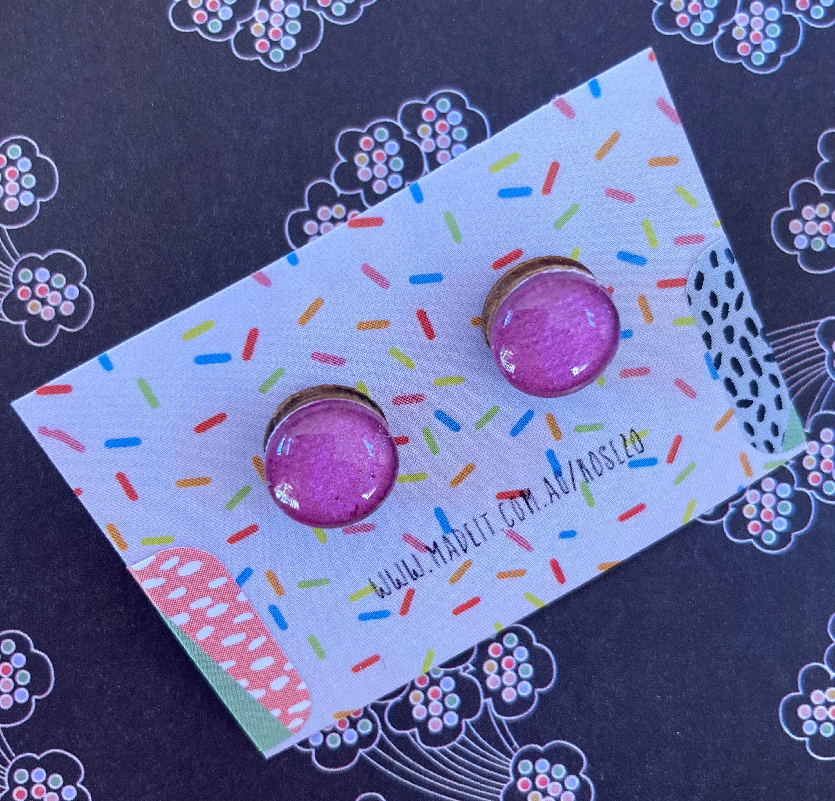 Magenta glass domed studs