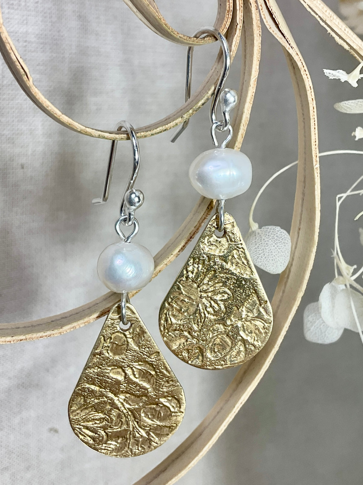 Brass tear drop with fresh water pearls.