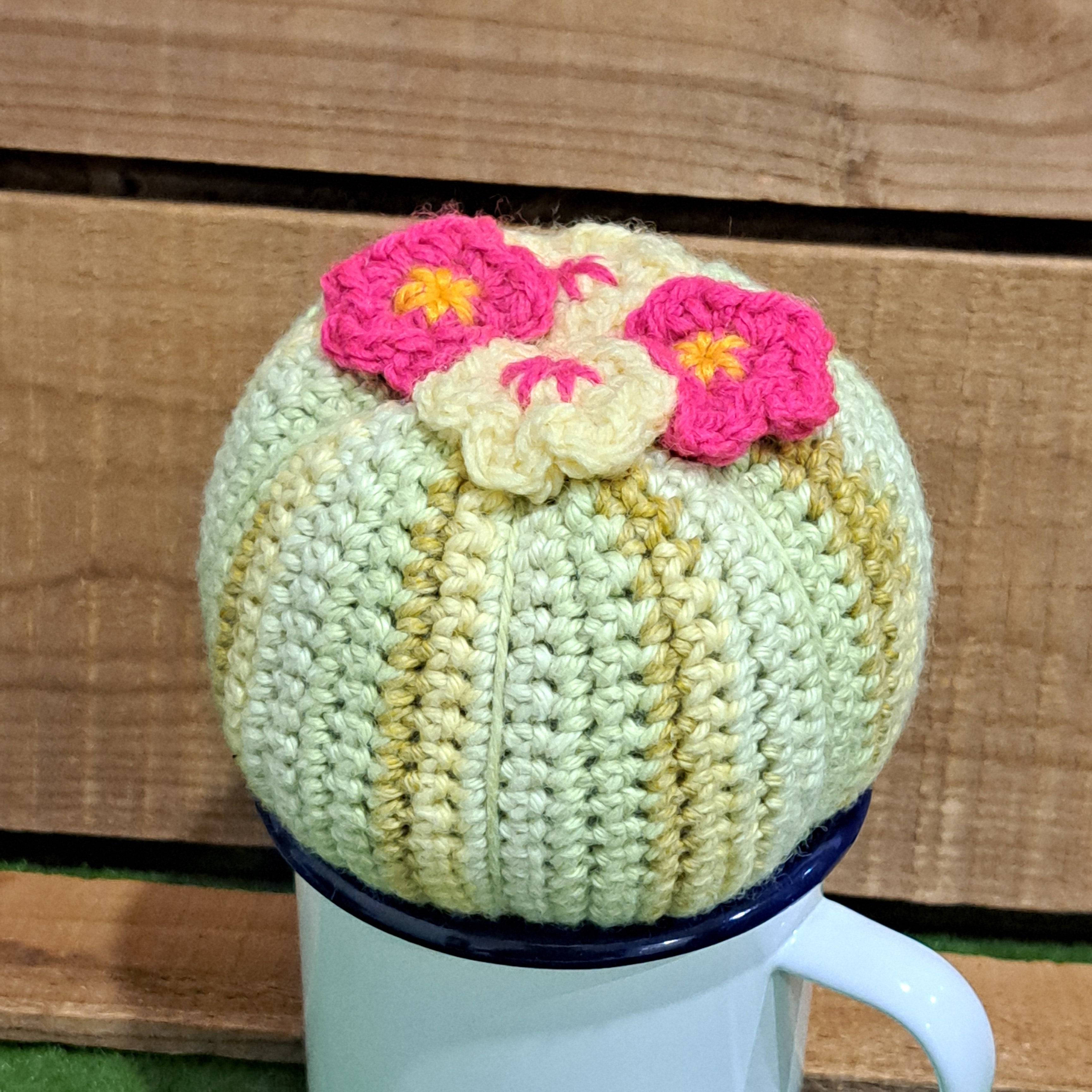 Crochet cactus/in a tin mug/ crochet pink and yellow flowers.