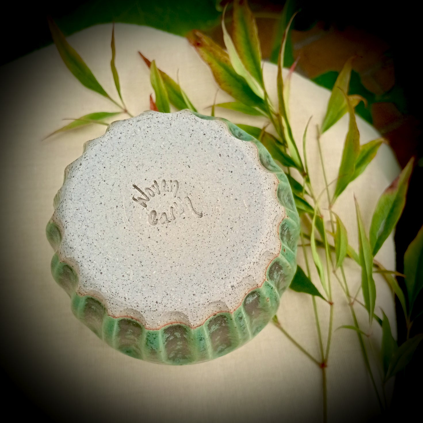 Rustic green and black coffee tumbler with rusty coloured flecks