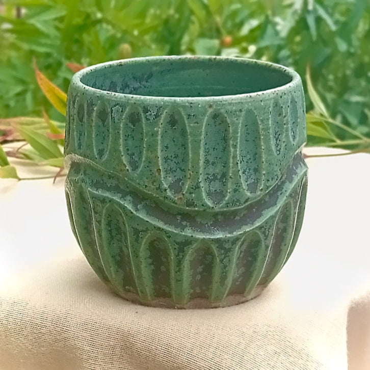 Rustic green and black coffee tumbler with rusty coloured flecks