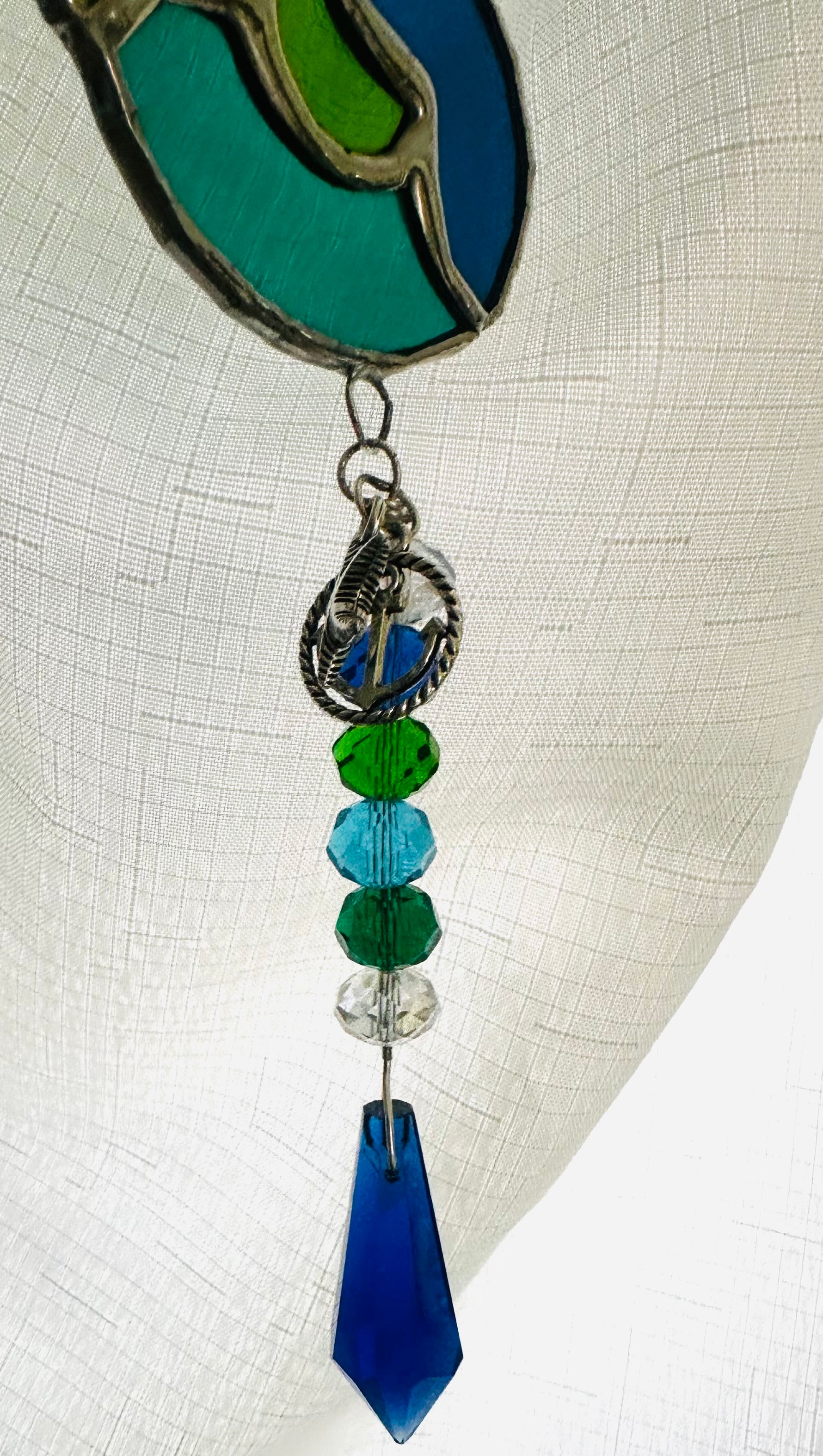 Stained glass seahorse in blue and green