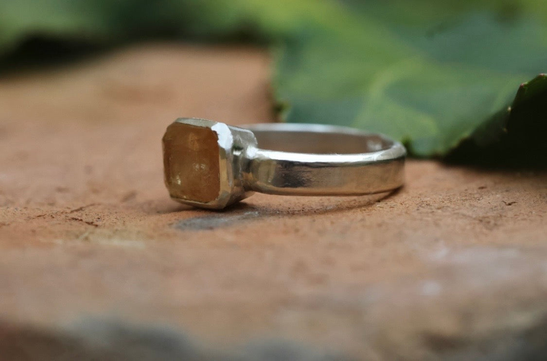 Emerald cut orange topaz in 925 silver