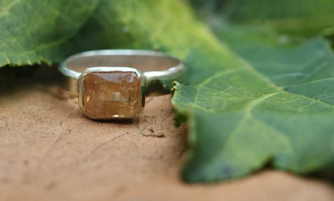 Emerald cut orange topaz in 925 silver