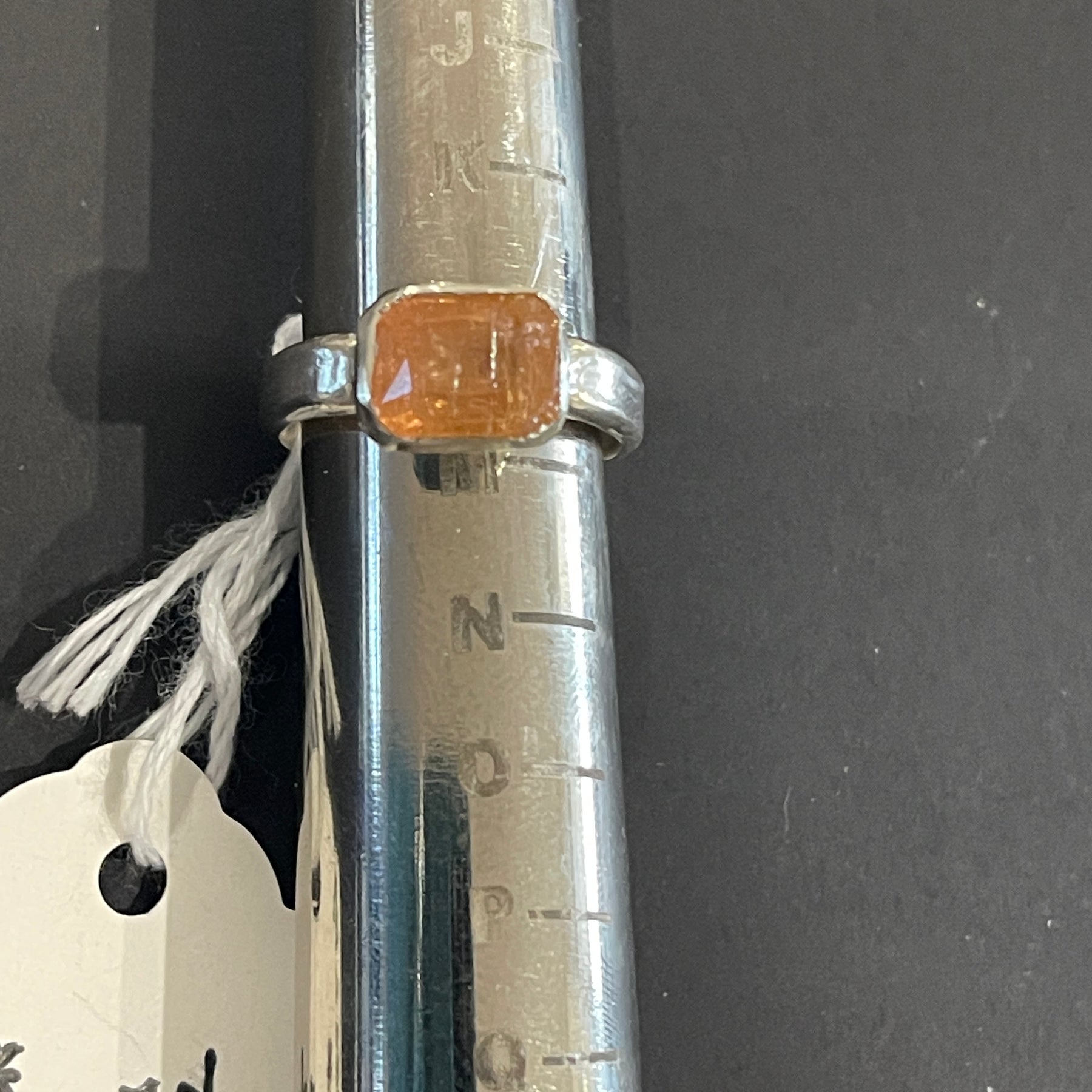 Emerald cut orange topaz in 925 silver