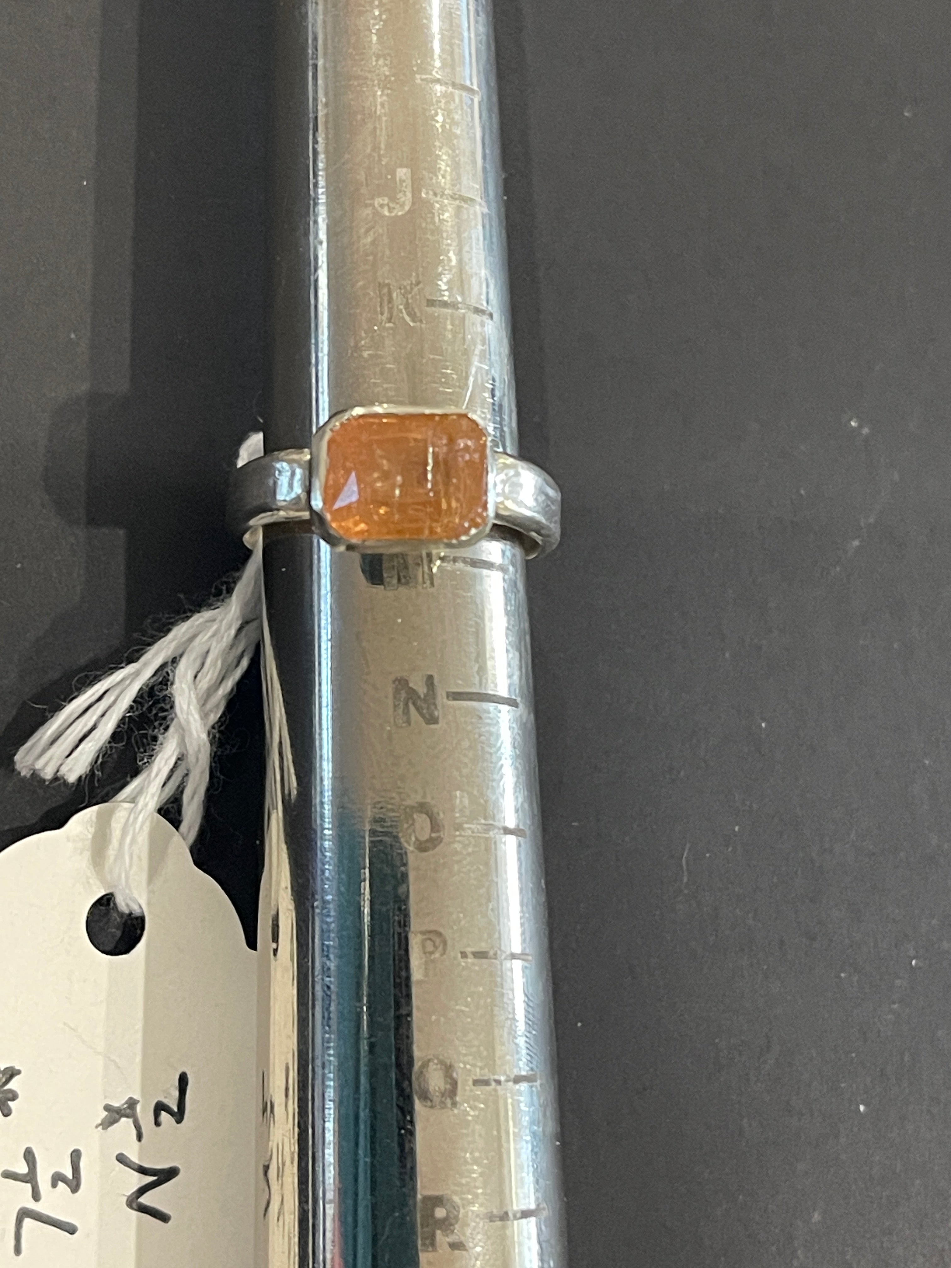 Emerald cut orange topaz in 925 silver