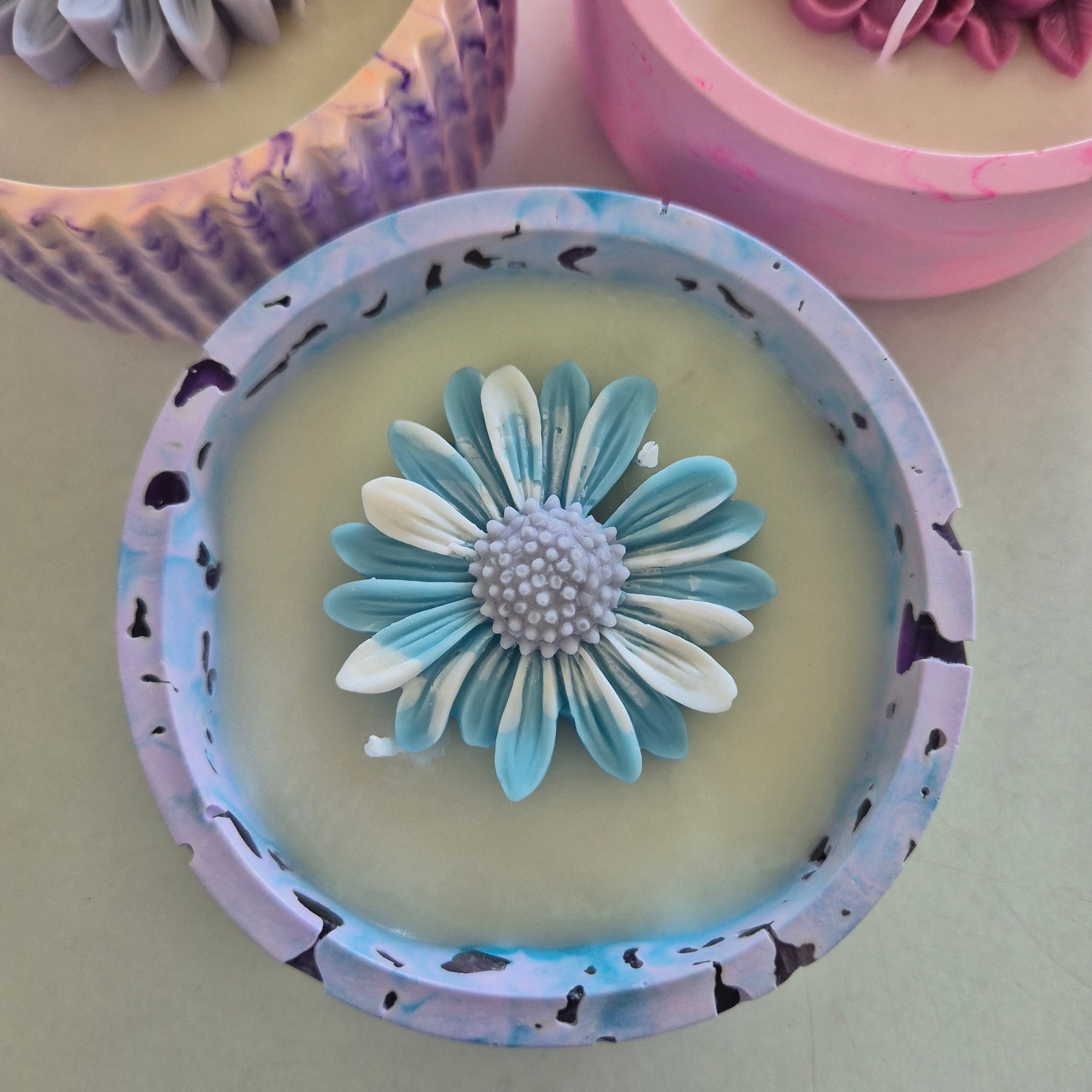 Round blue and purple concrete bowl candle with amethyst stones