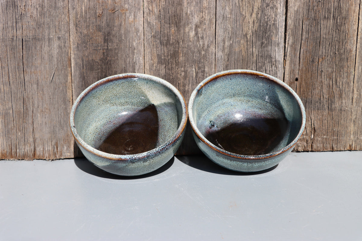 Stoneware bowls hand made with white speckled chun glaze over teadust brown.