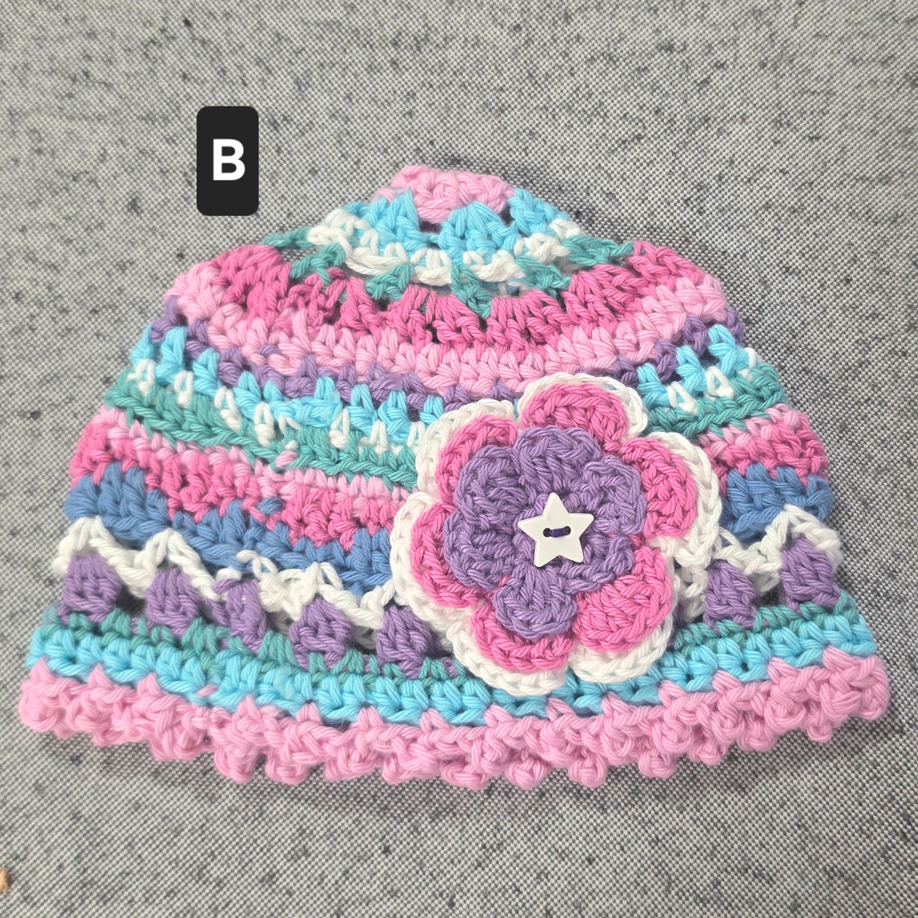 Crocheted Baby Hat with Flower Detail