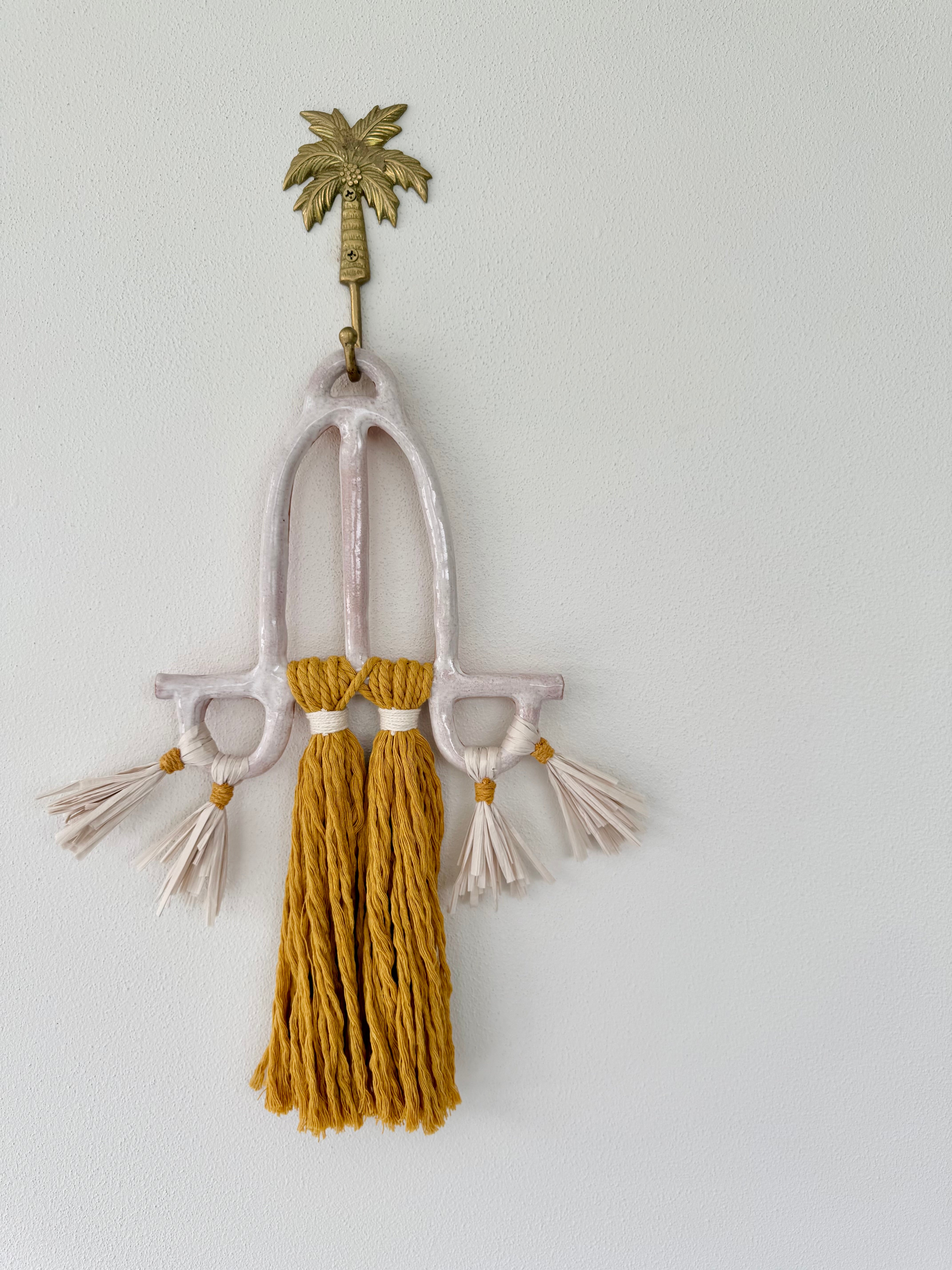 Clay and cord wall hanging
