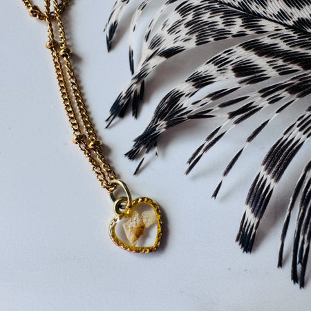 Gold plated resin necklace with white wildflower