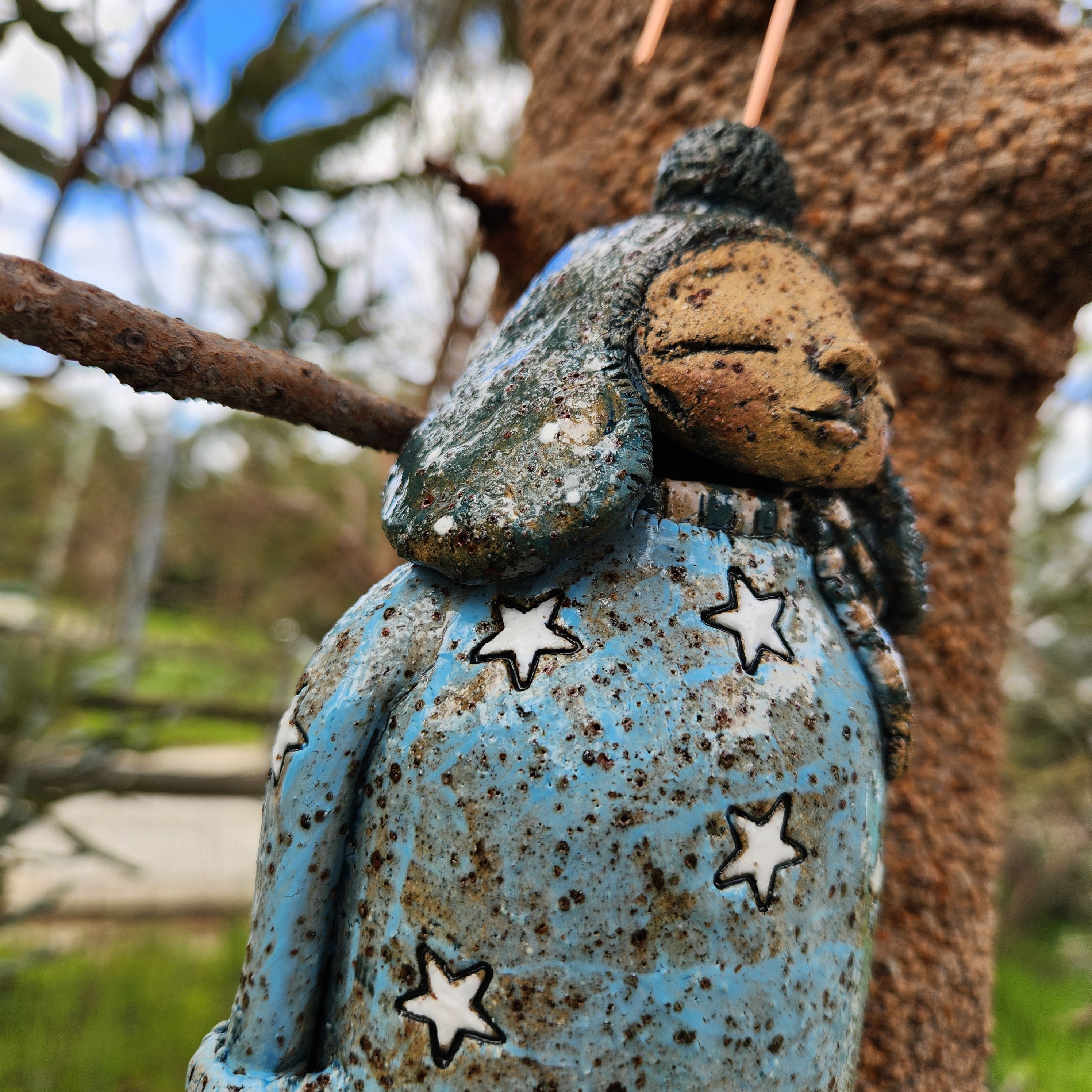 Clay windchime, little girl, stars, spots