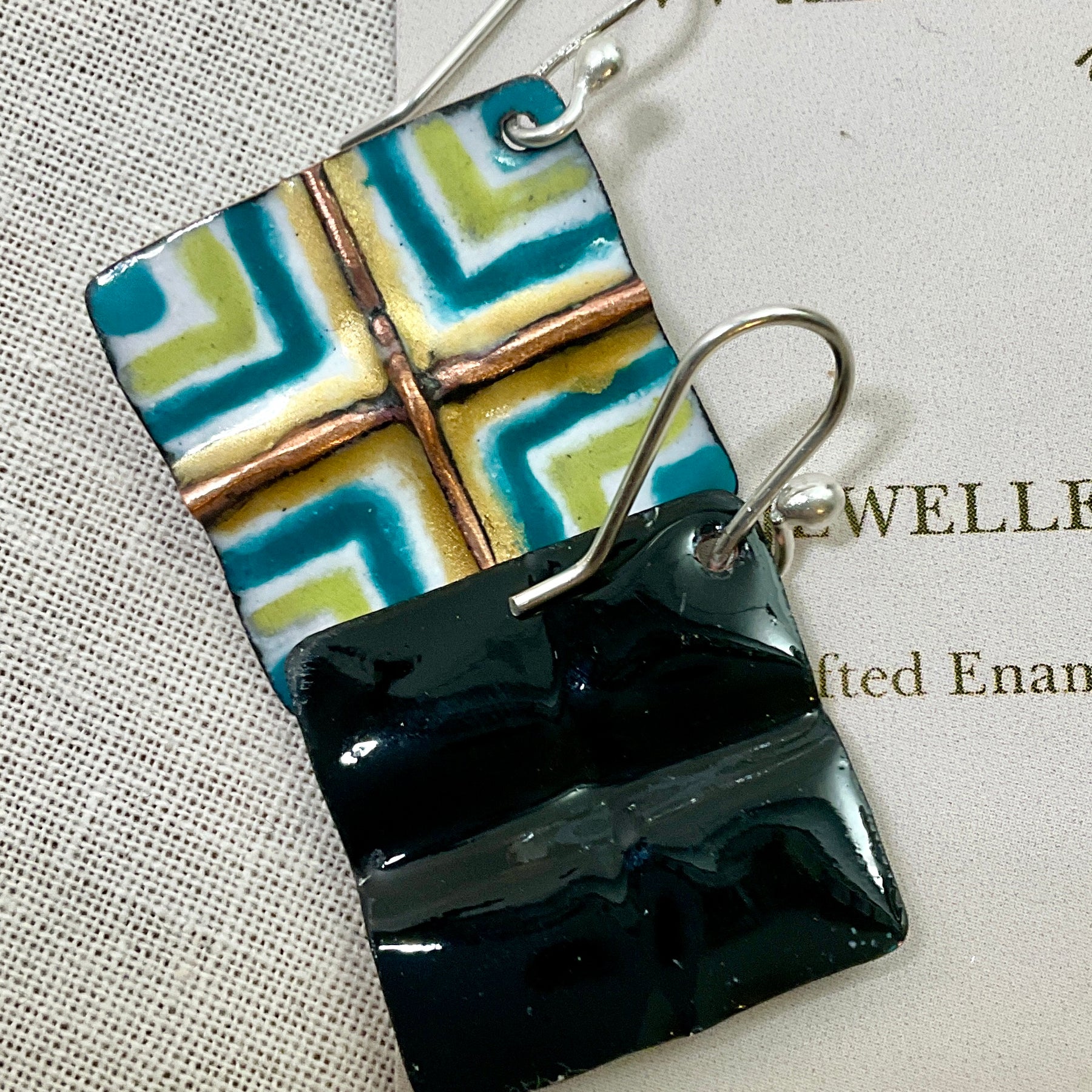 White, gold, teal and green fold form enamel earrings. Handmade