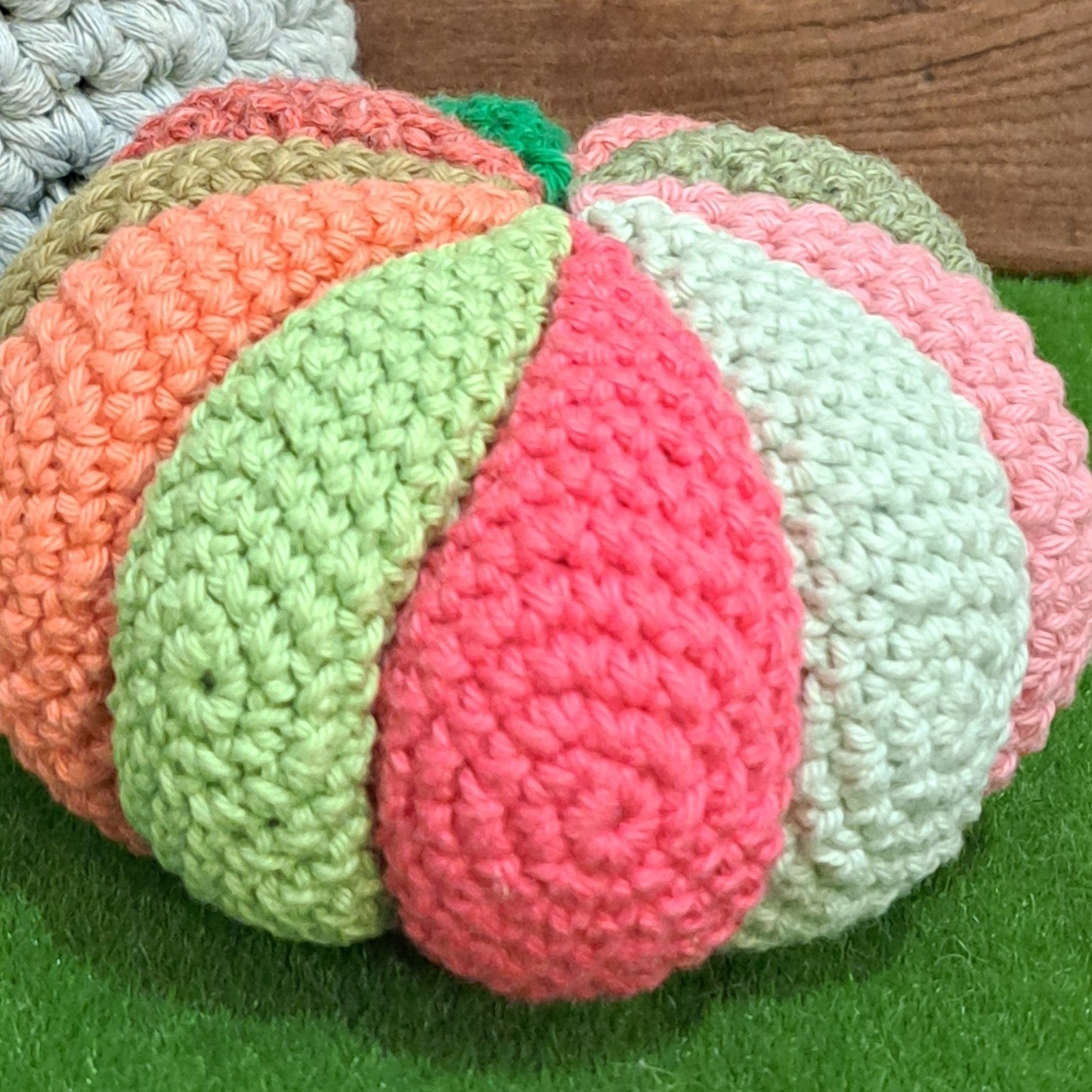 Crochet sensory ball/ with internal rattle/ pink and green colours