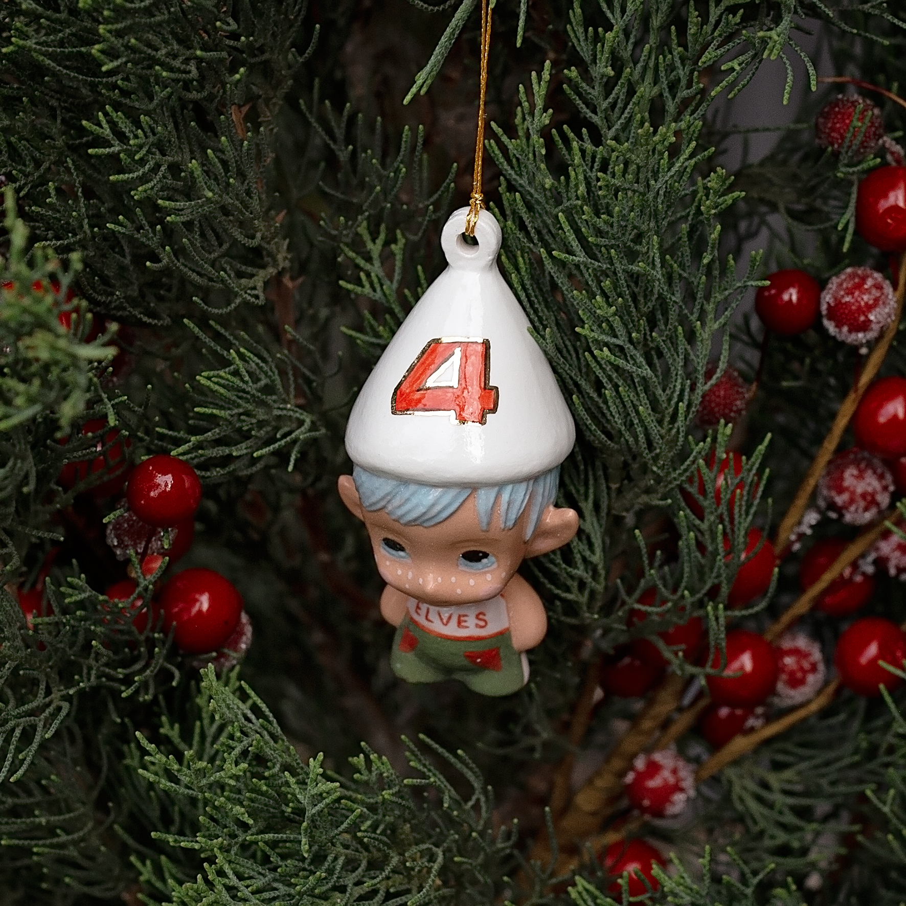 Handmade Porcelain Christmas ornament. One-of-a-kind. Kade the footy Elf.