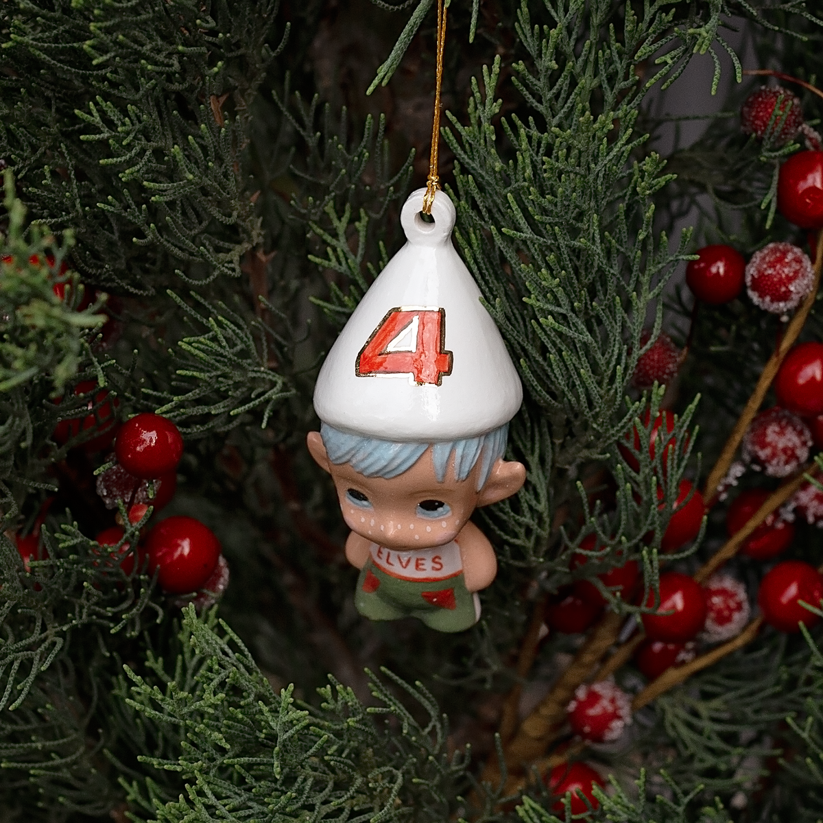 Handmade Porcelain Christmas ornament. One-of-a-kind. Kade the footy Elf.