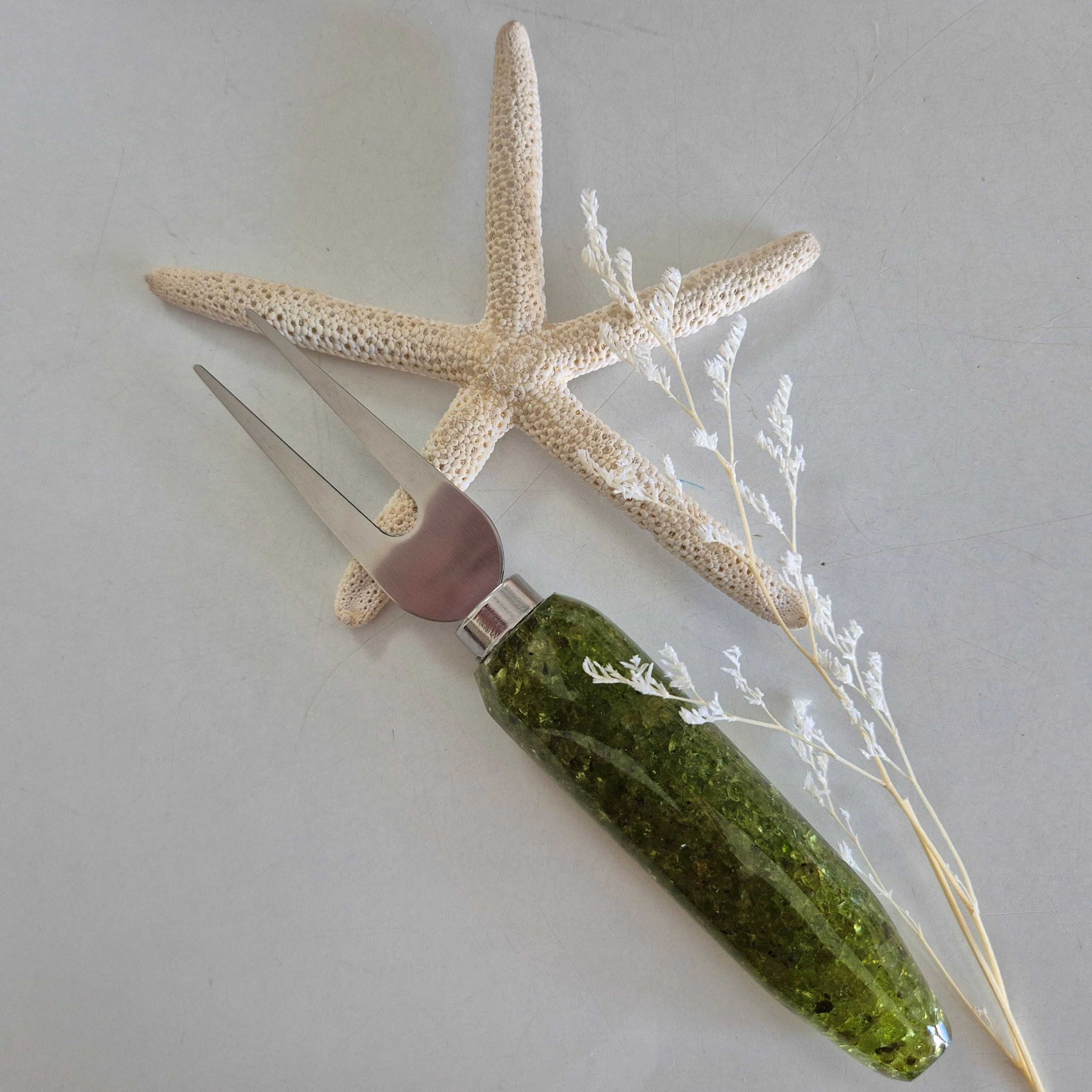 Resin bottle opener and cheese knife set with peridot