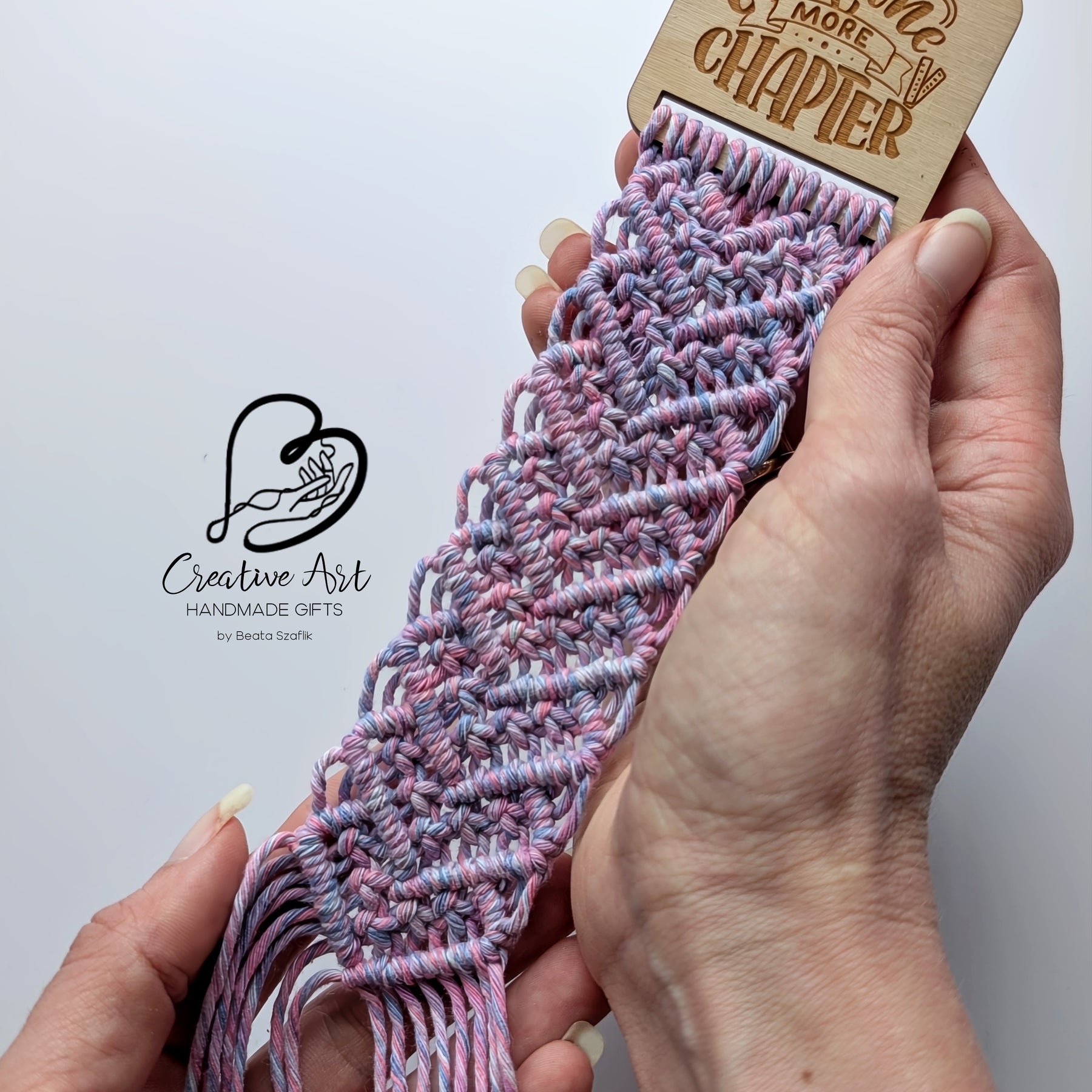 Macrame bookmark on wooden base