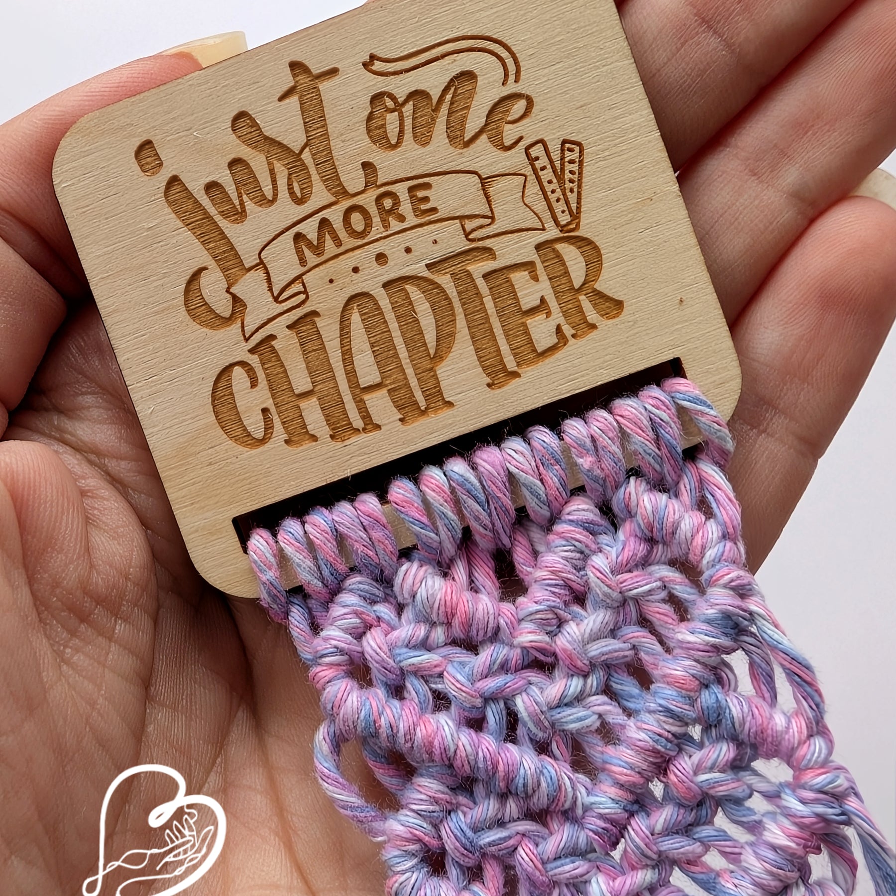 Macrame bookmark on wooden base
