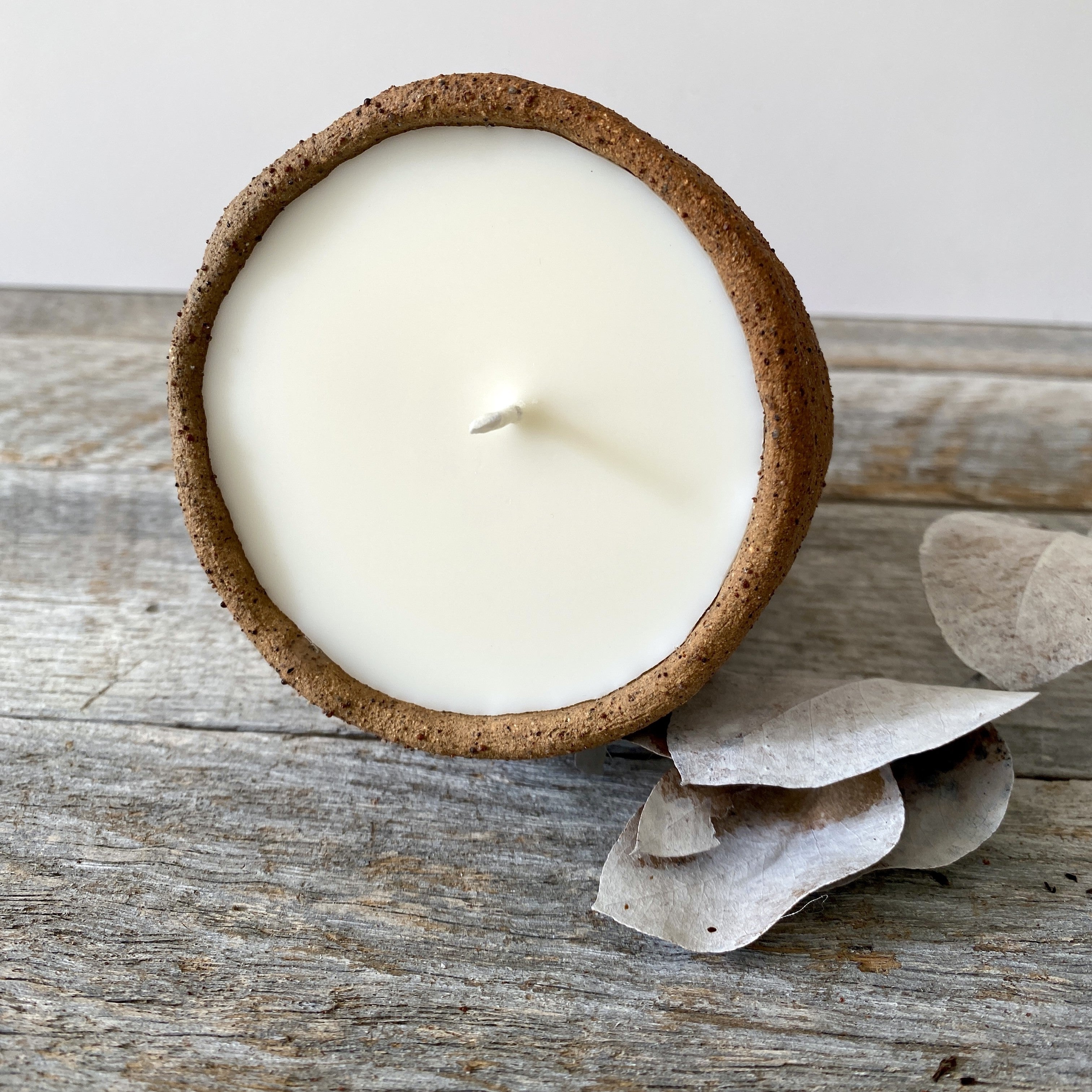 Hand poured soy candle in rustic handmade ceramic vessel