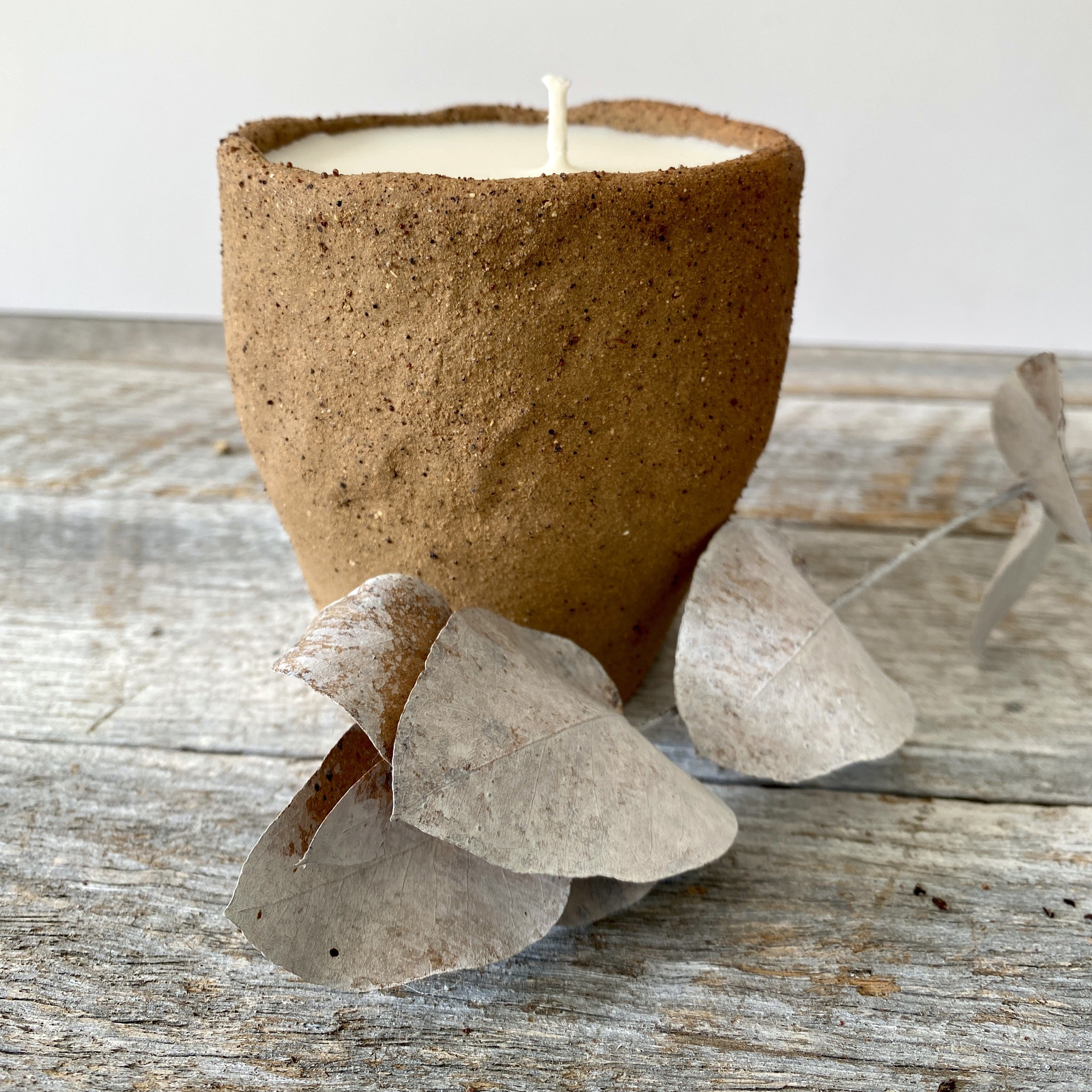 Hand poured soy candle in rustic handmade ceramic vessel
